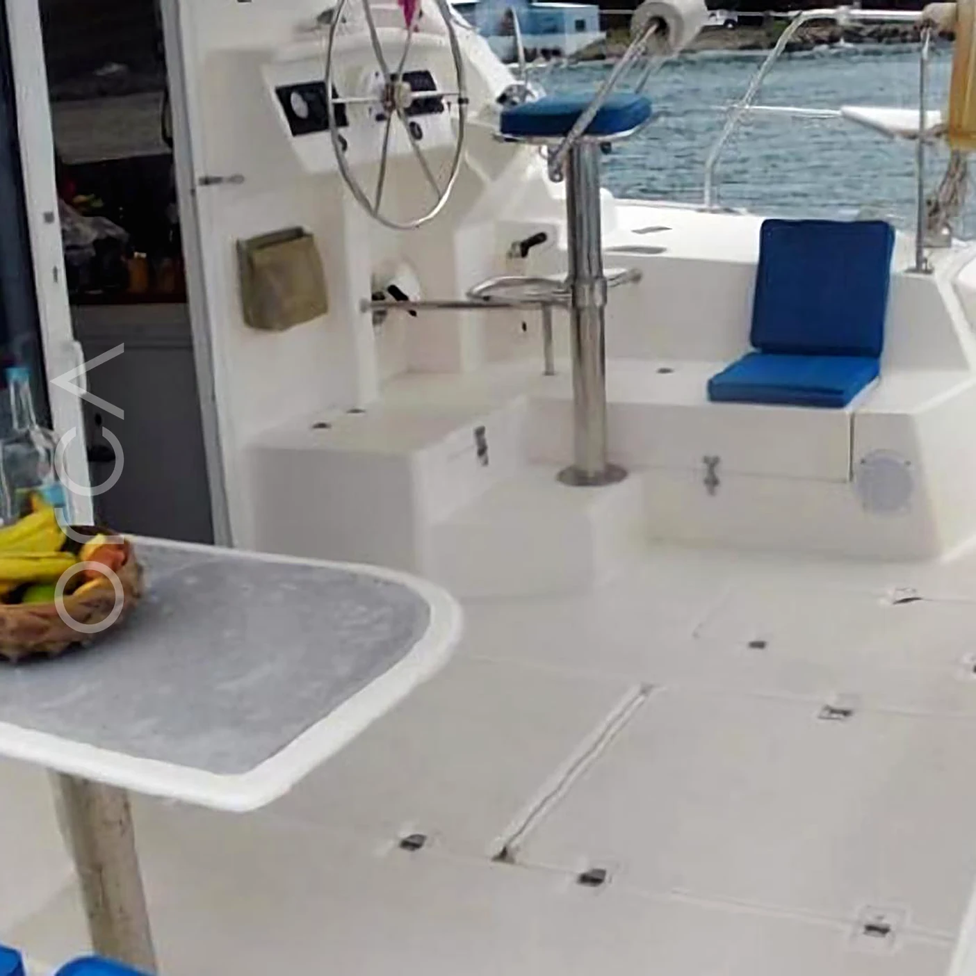 An Island Spirit 401 sailing catamaran in Mumbai, the helm, available to rent from Orca Sail.