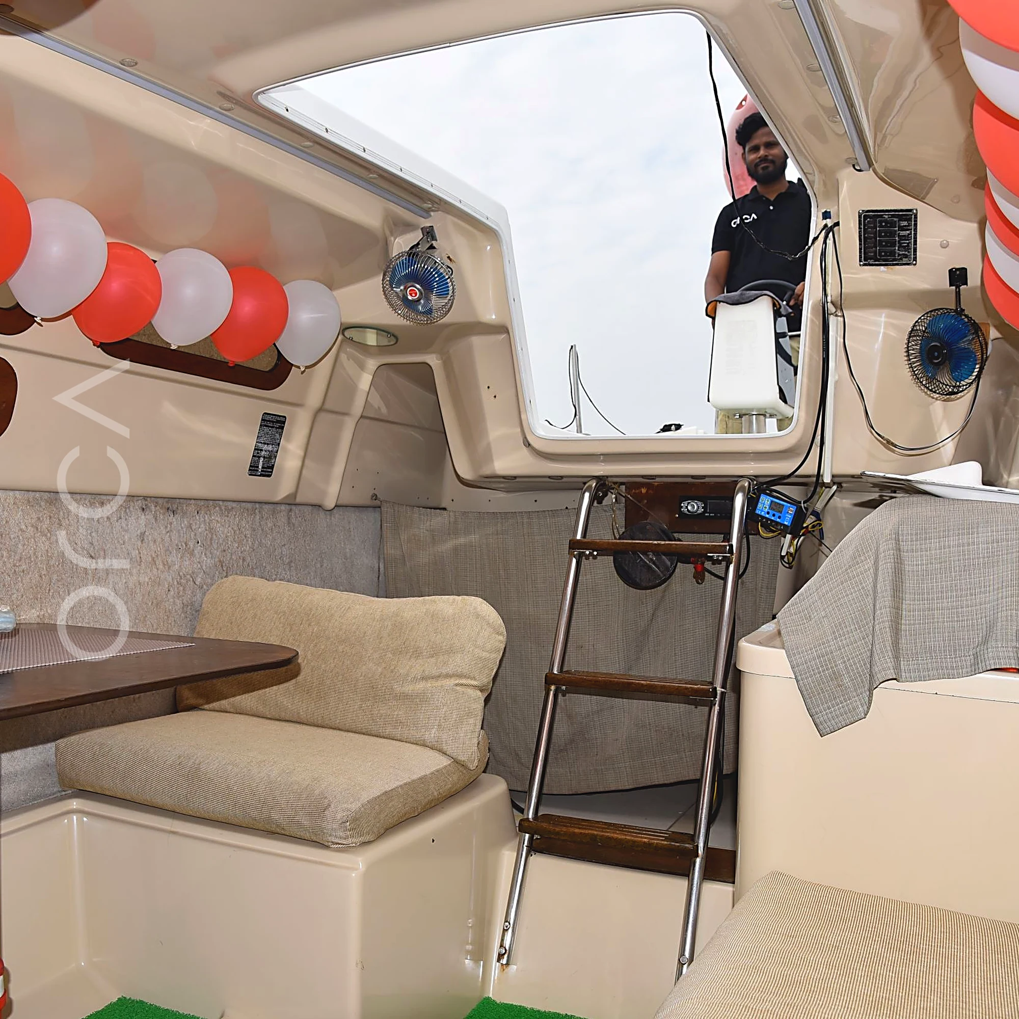 A Macgregor 26 sailboat in Mumbai, the saloon, available to rent from Orca Sail.
