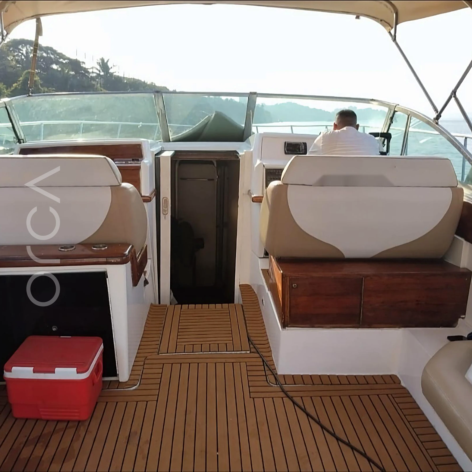 A Formula 40 motor yacht in Goa, the main seating area, available to rent from Orca Sail.
