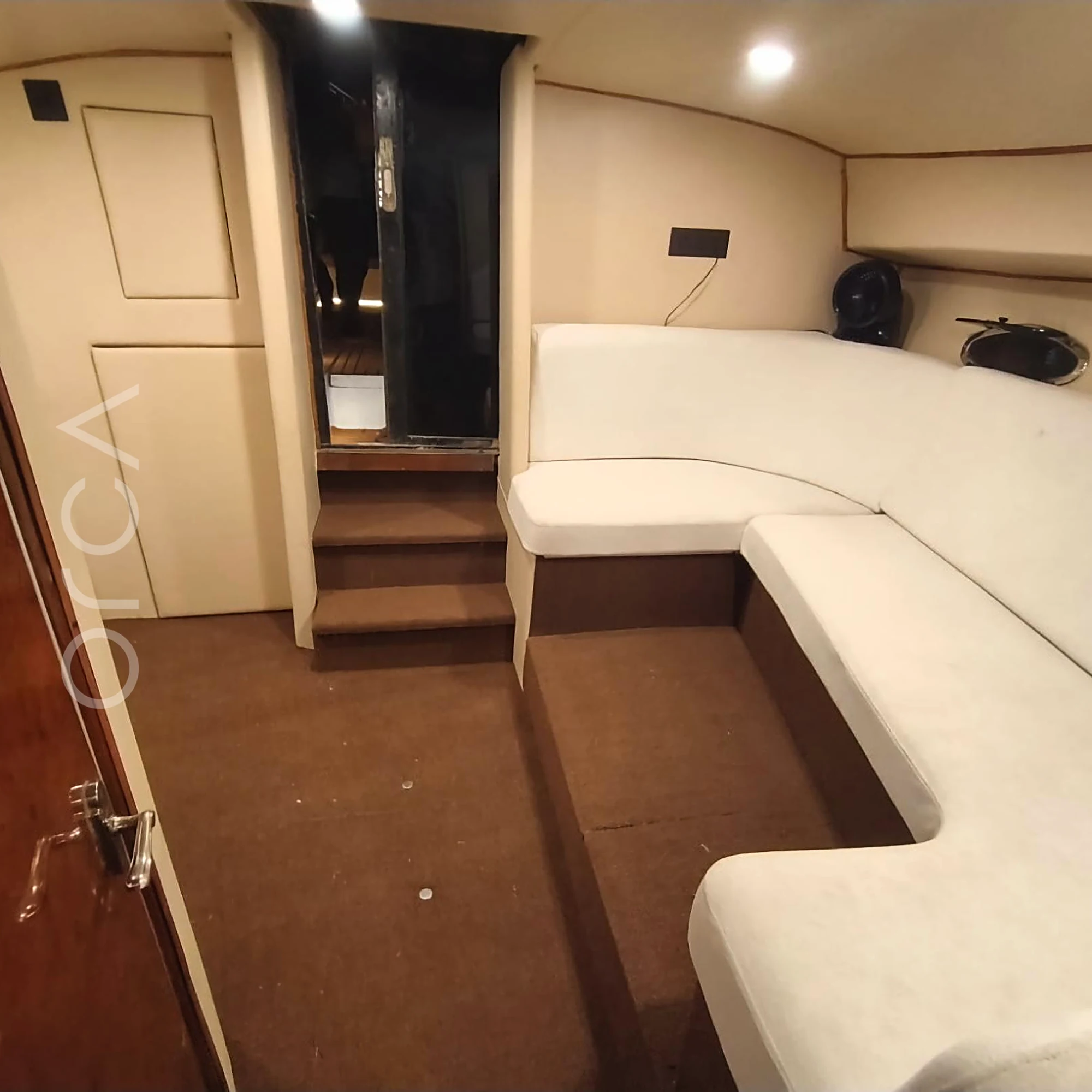 A Formula 40 motor yacht in Goa, the saloon, available to rent from Orca Sail.