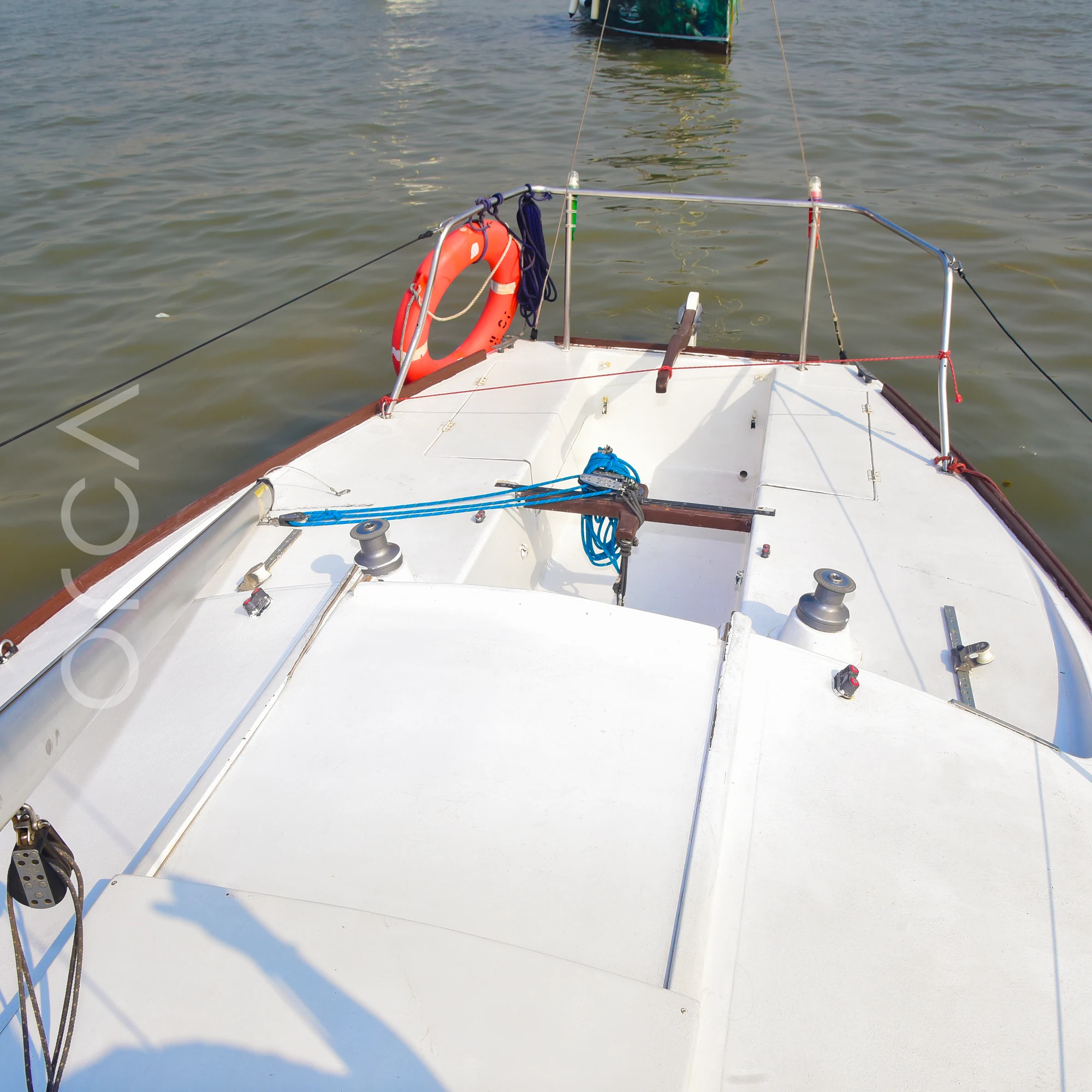 The cockpit of a J24 sailboat in Mumbai, where guests sit while sailing.