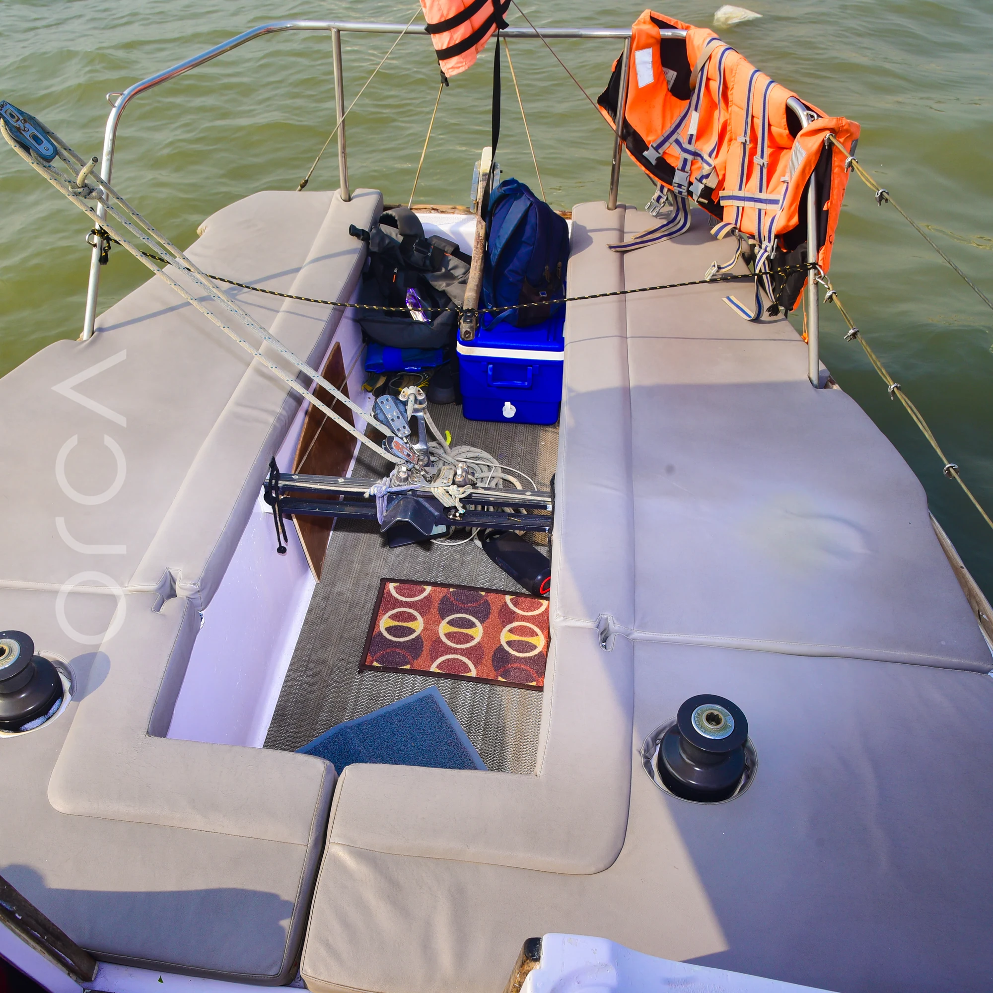The cockpit of a J24 sailboat in Mumbai, where guests sit while sailing.