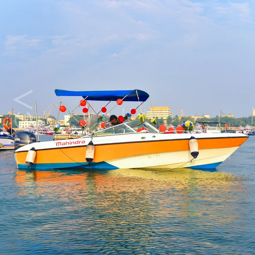 The Mahindra speedboat on the water in Mumbai, representing the boats available to rent from Orca Sail.