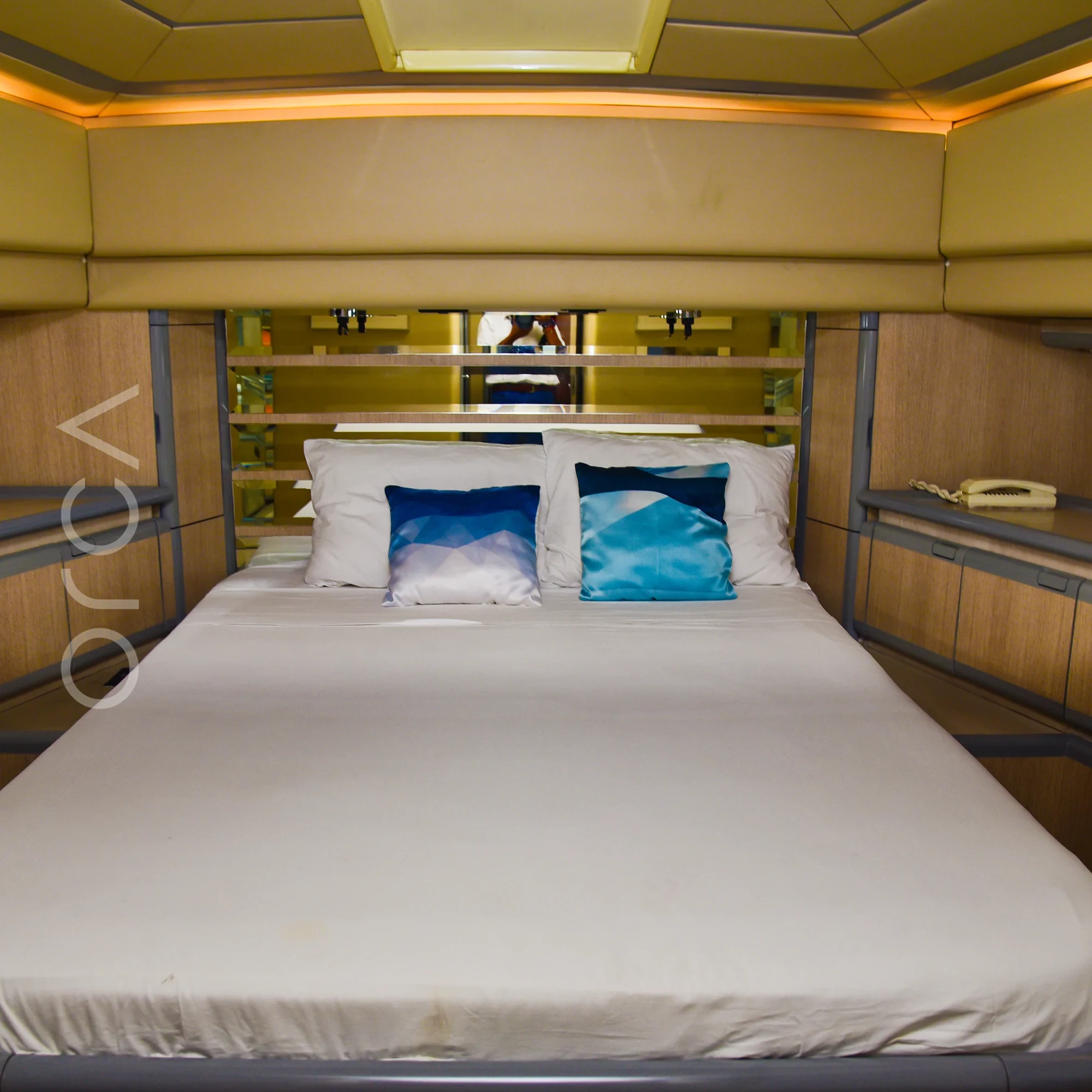The main cabin aboard a Ferretti 88 luxury motor yacht in Mumbai, available to rent from Orca Sail.