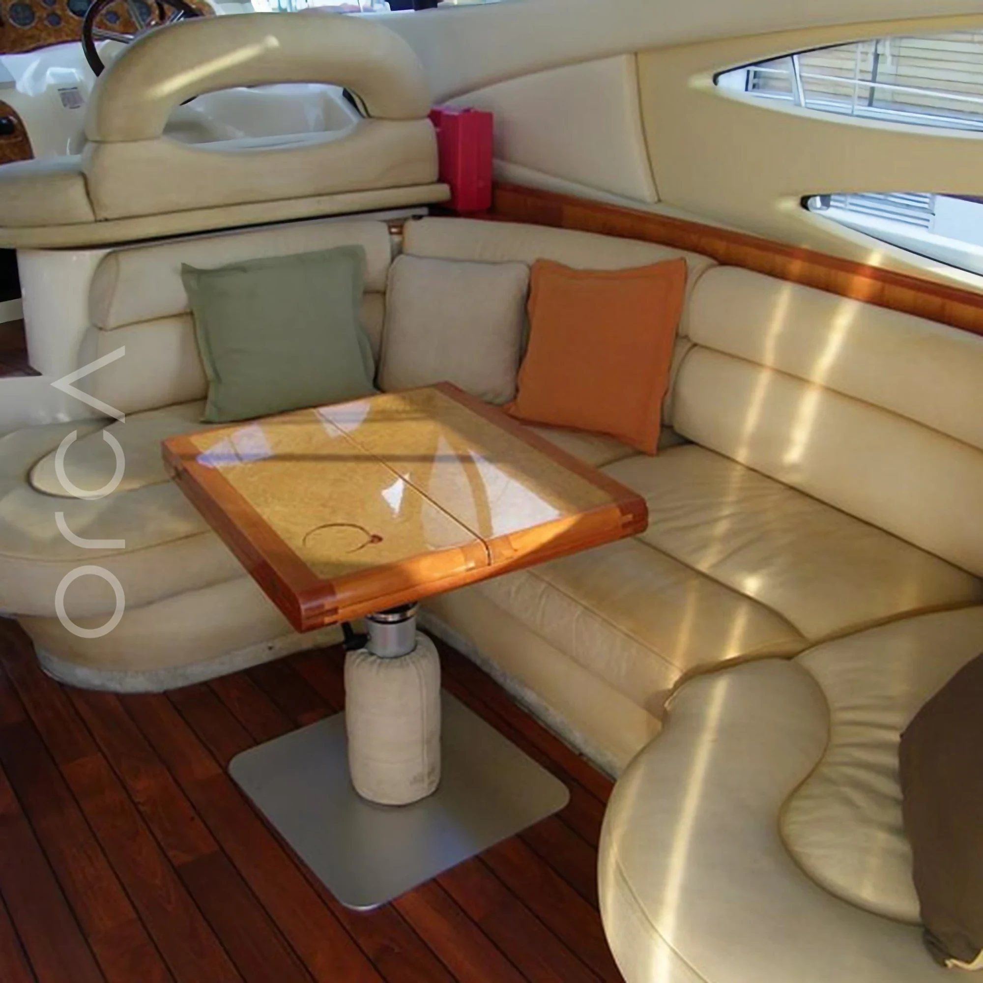 The main seating area aboard a Azimut 39 motor yacht in Mumbai, available to rent from Orca Sail.