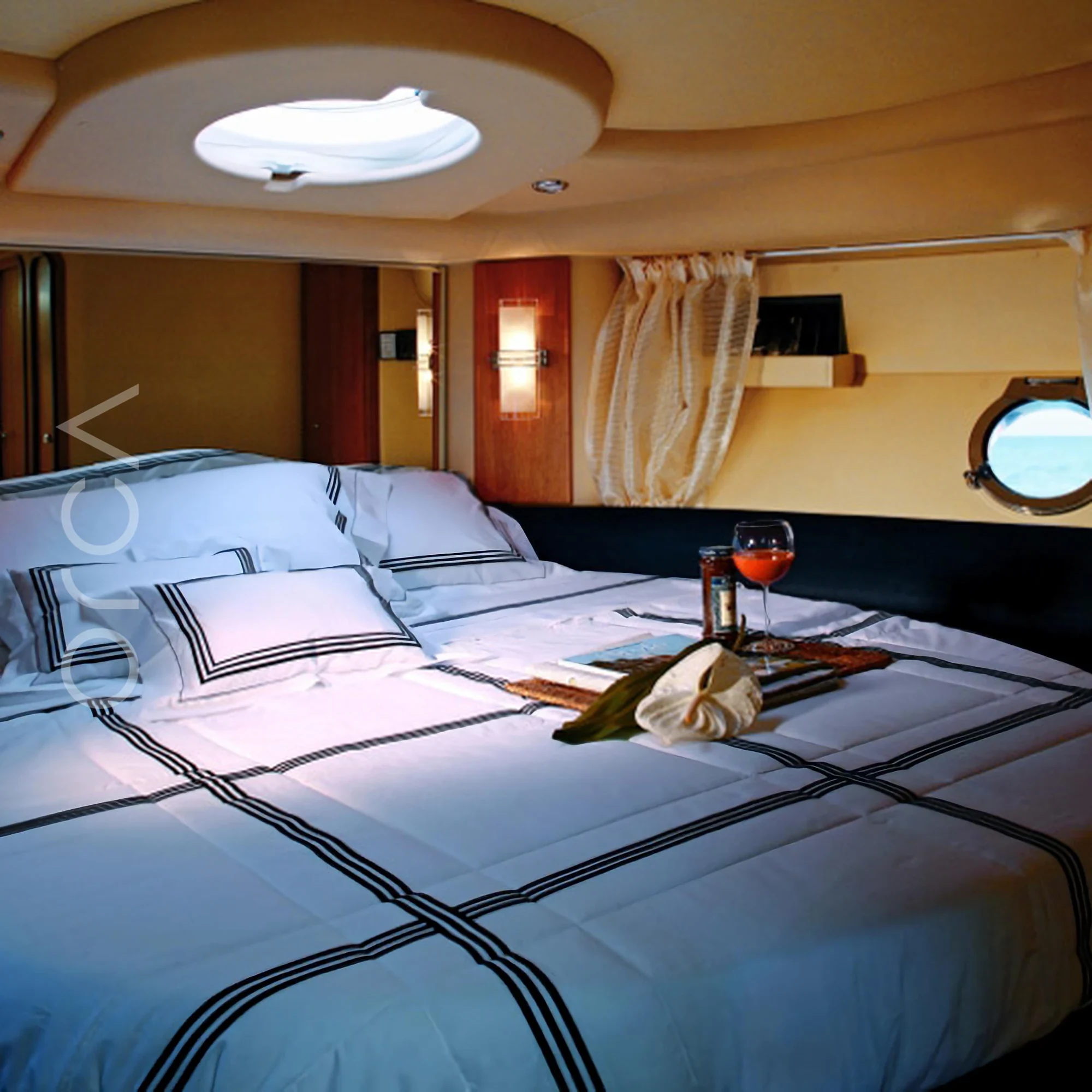 The main cabin aboard a Azimut 39 motor yacht in Mumbai, available to rent from Orca Sail.
