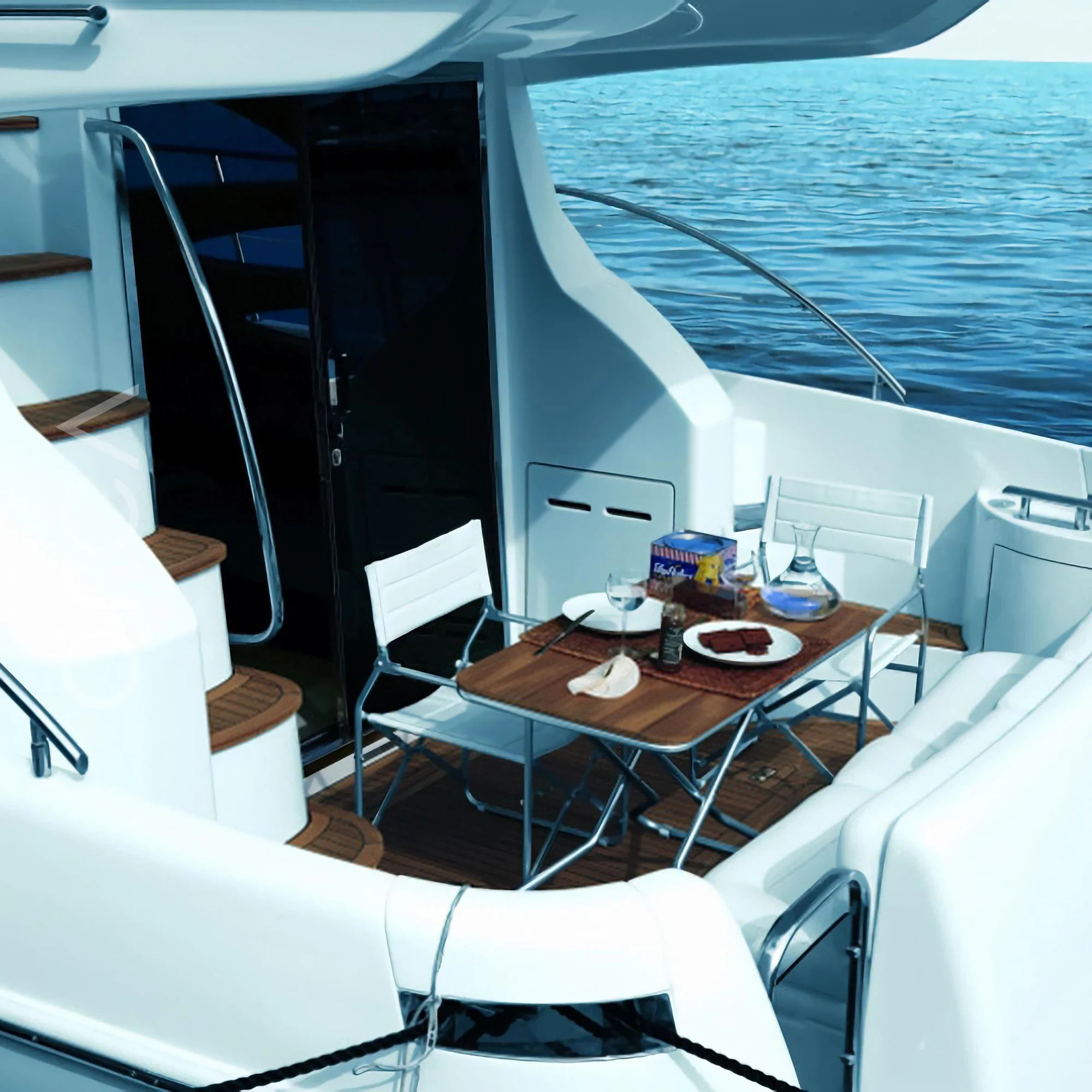The aft deck of a Azimut 39 motor yacht in Mumbai, available to rent from Orca Sail.