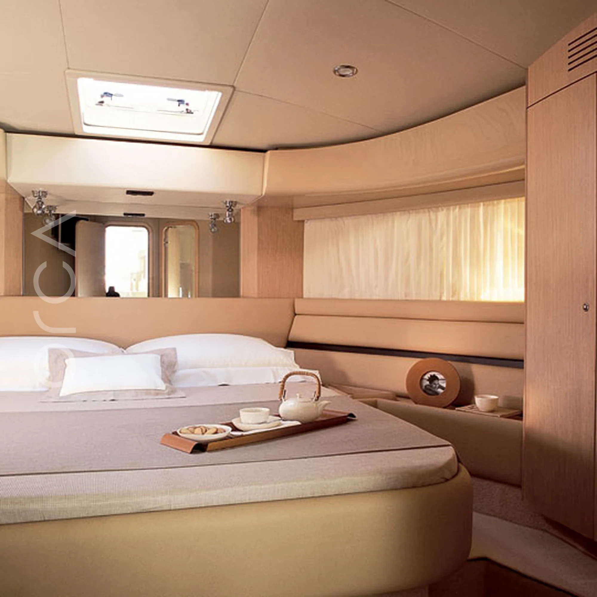 The main cabin aboard a Ferretti 550 luxury motor yacht in Goa, representing the boats available to rent from Orca Sail.