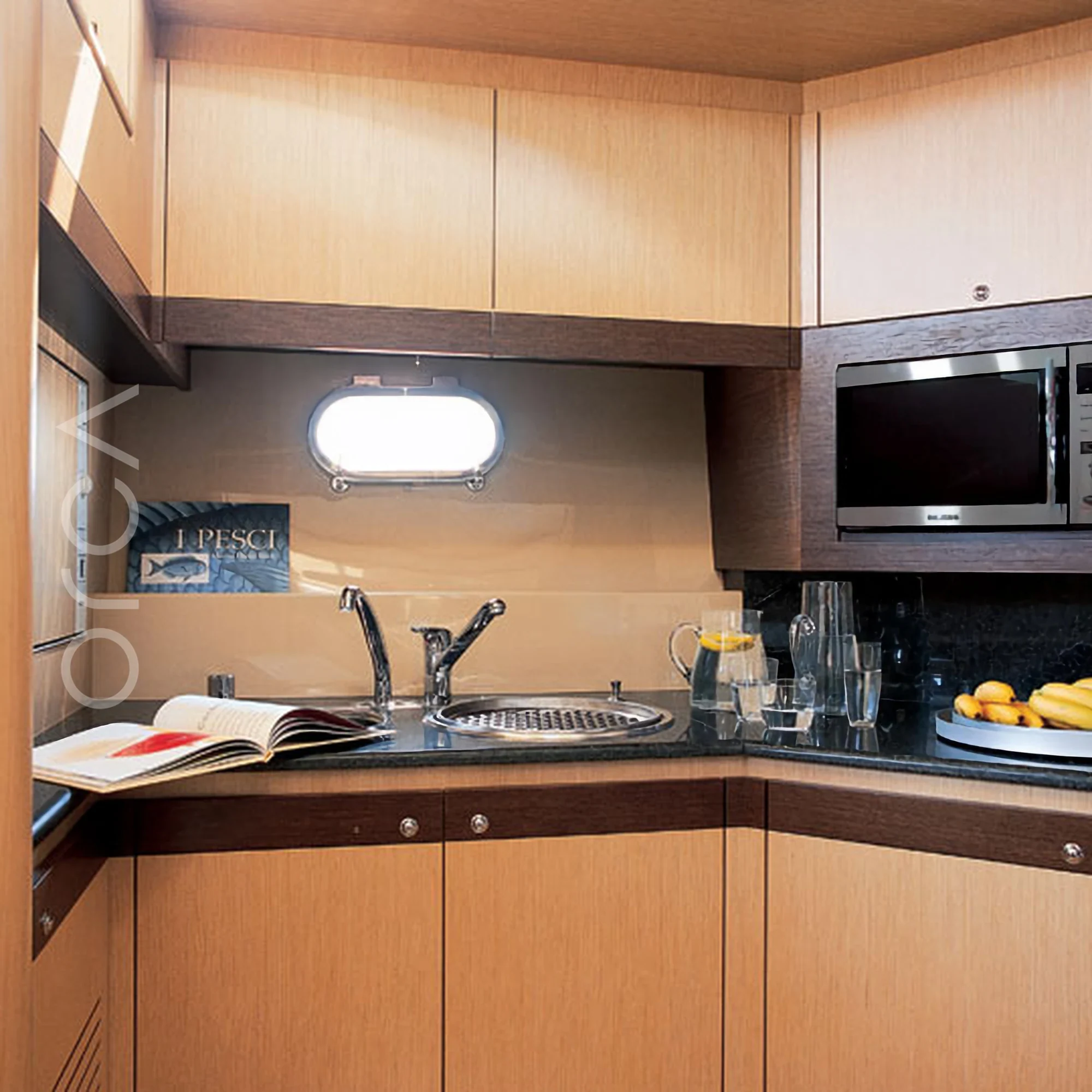 The galley aboard a Ferretti 550 luxury motor yacht in Goa, representing the boats available to rent from Orca Sail.