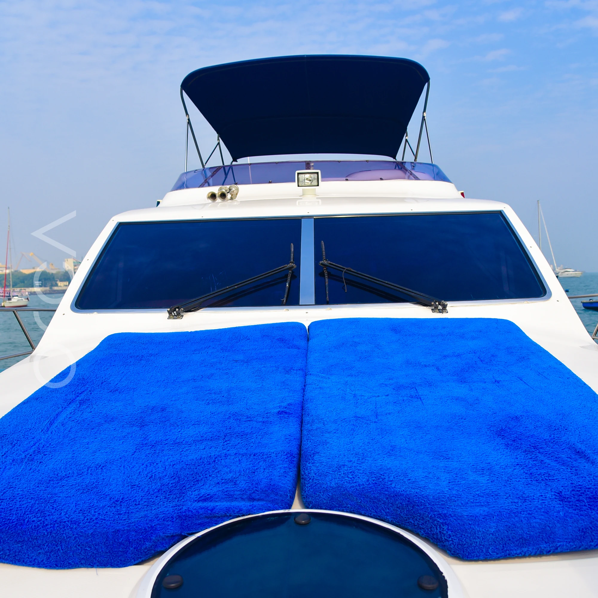 The forward sunpad on the bow deck of a Majesty 44 motor yacht in Mumbai, available to rent from Orca Sail.