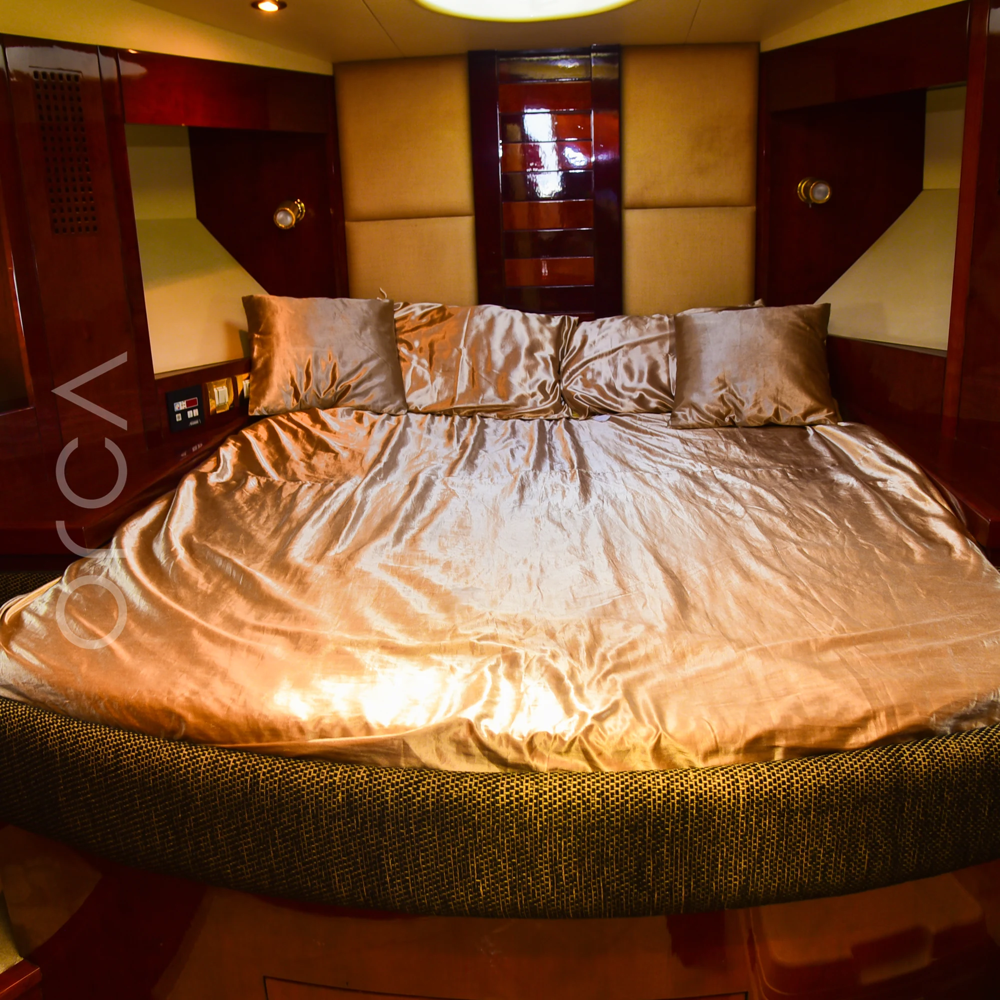 The master cabin of a Majesty 44 motor yacht in Mumbai, with a double bed, available to rent from Orca Sail.