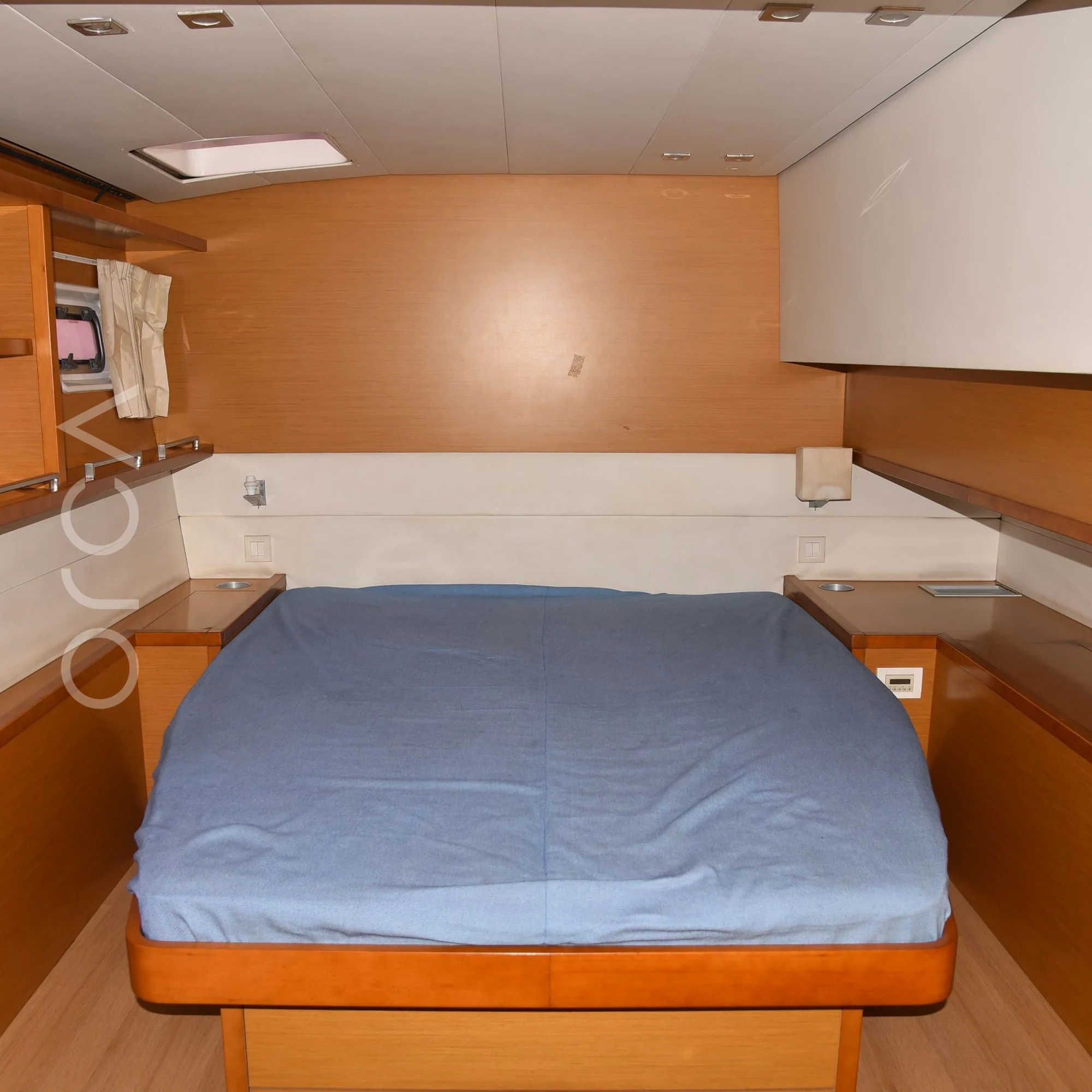 The main cabin aboard a Lagoon 560 luxury sail yacht catamaran in Mumbai, available to rent from Orca Sail.
