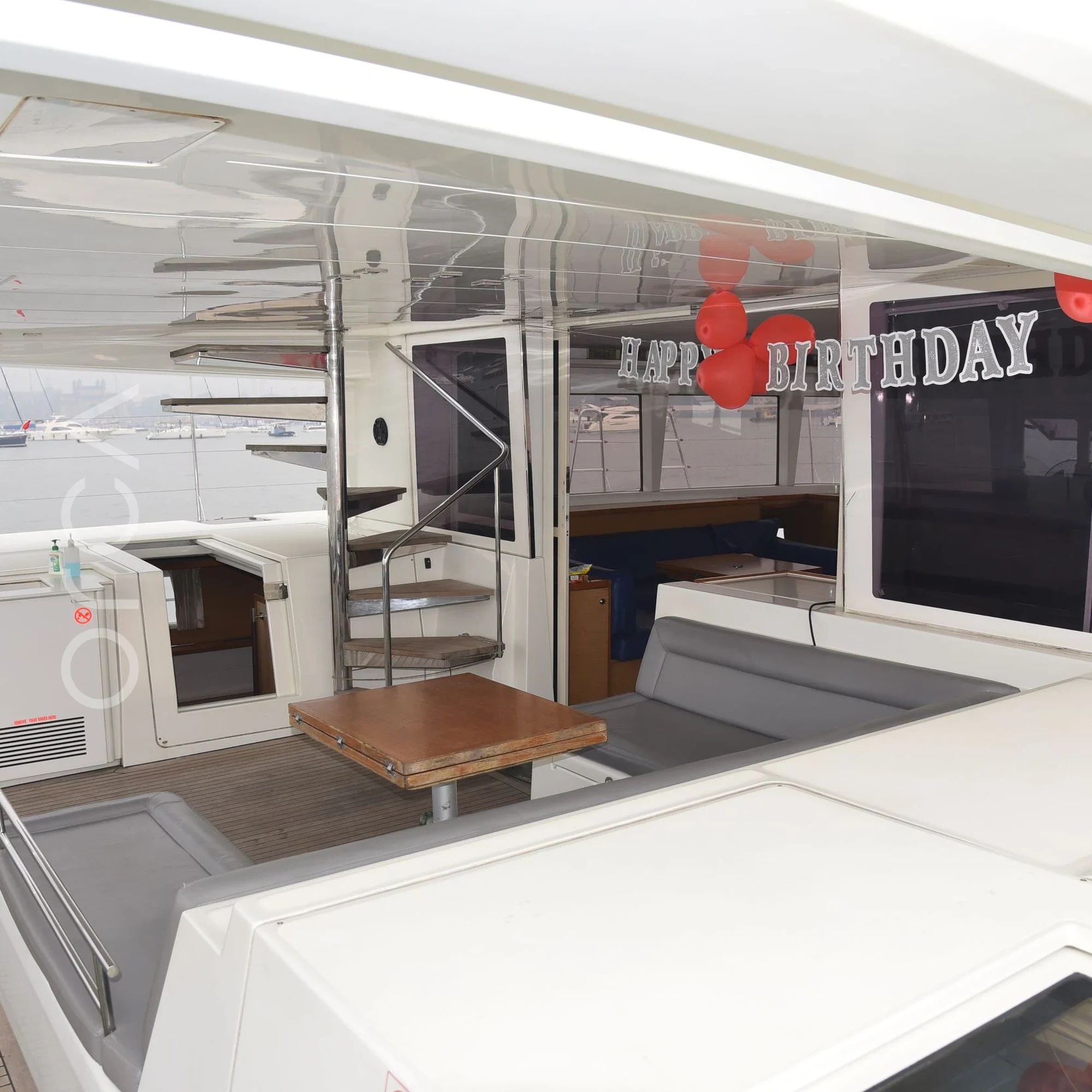 The aft deck of a Lagoon 560 luxury sail yacht catamaran in Mumbai, available to rent from Orca Sail.