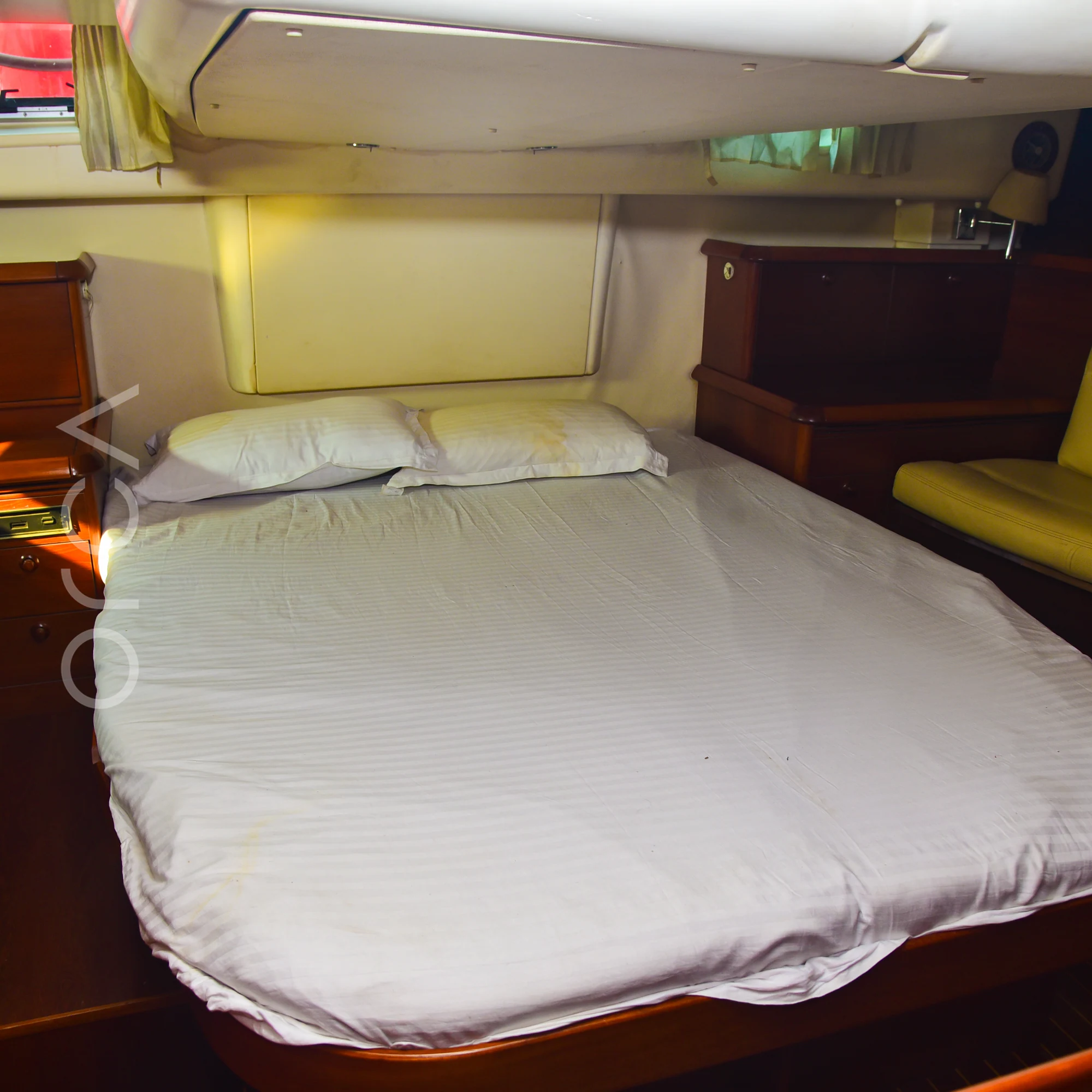The master cabin of a Jeanneau 54 sail yacht in Mumbai, with a double bed, available to rent from Orca Sail.