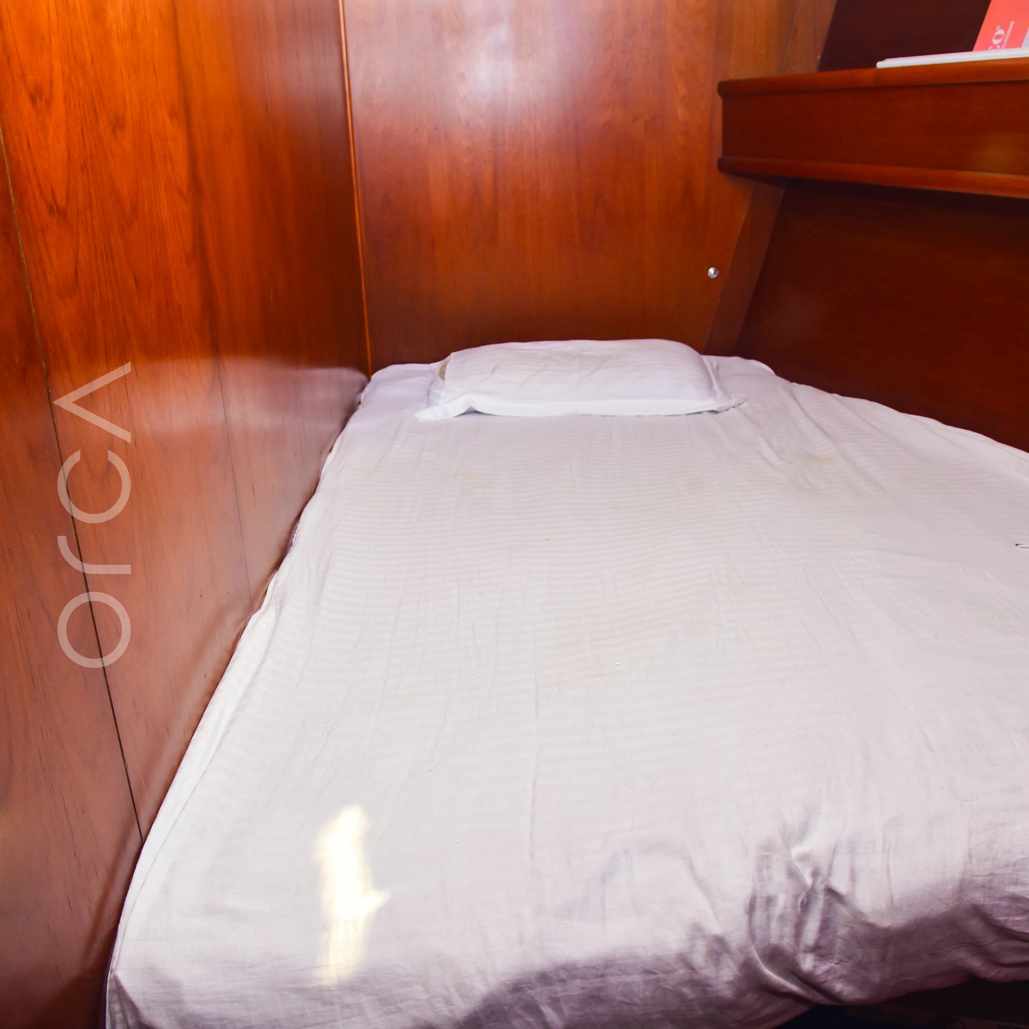 A second cabin aboard a Jeanneau 54 sail yacht in Mumbai, with a bed, available to rent from Orca Sail.