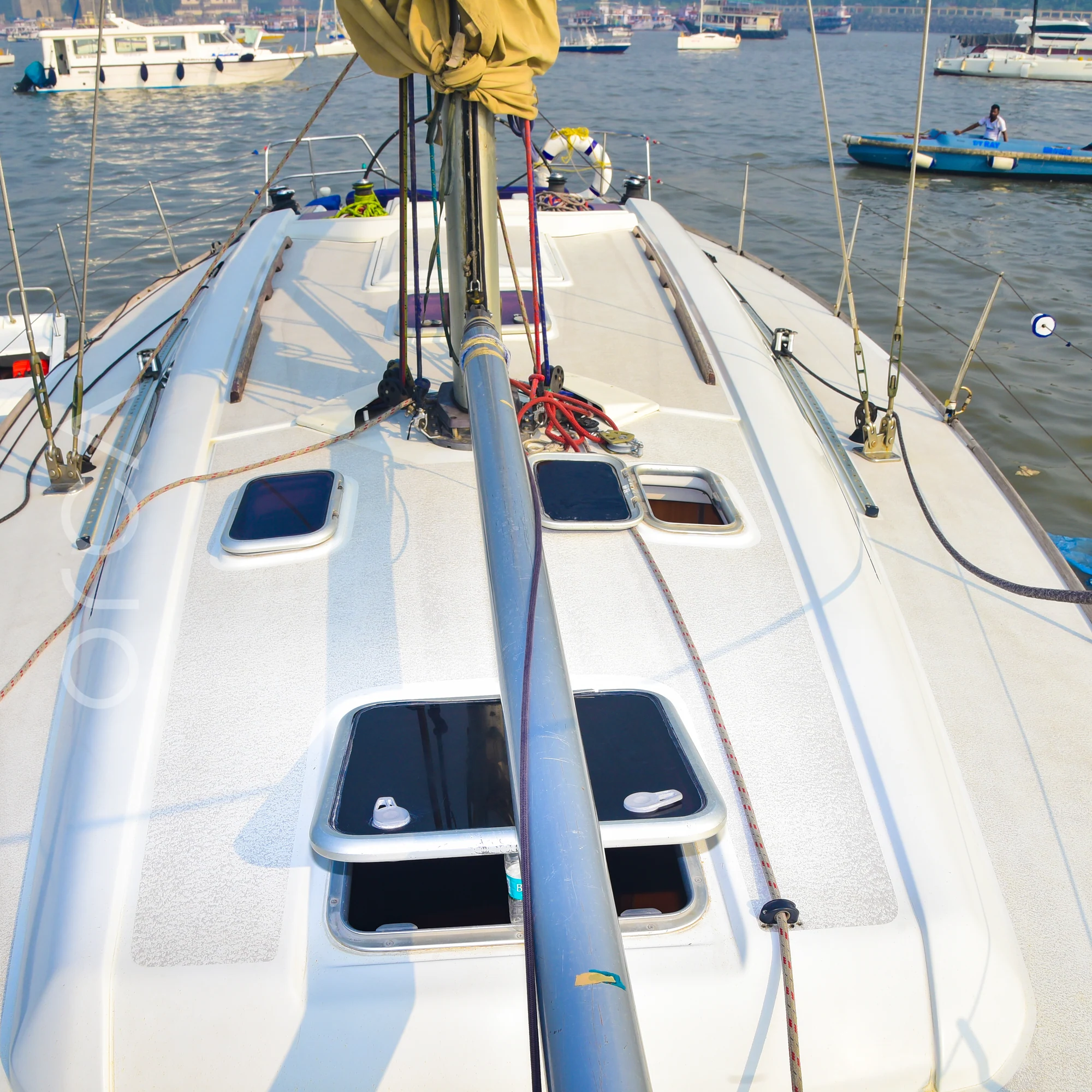 The foredeck of a Grand Soleil 45 sail yacht in Mumbai, looking forward past the mast, available to rent from Orca Sail.