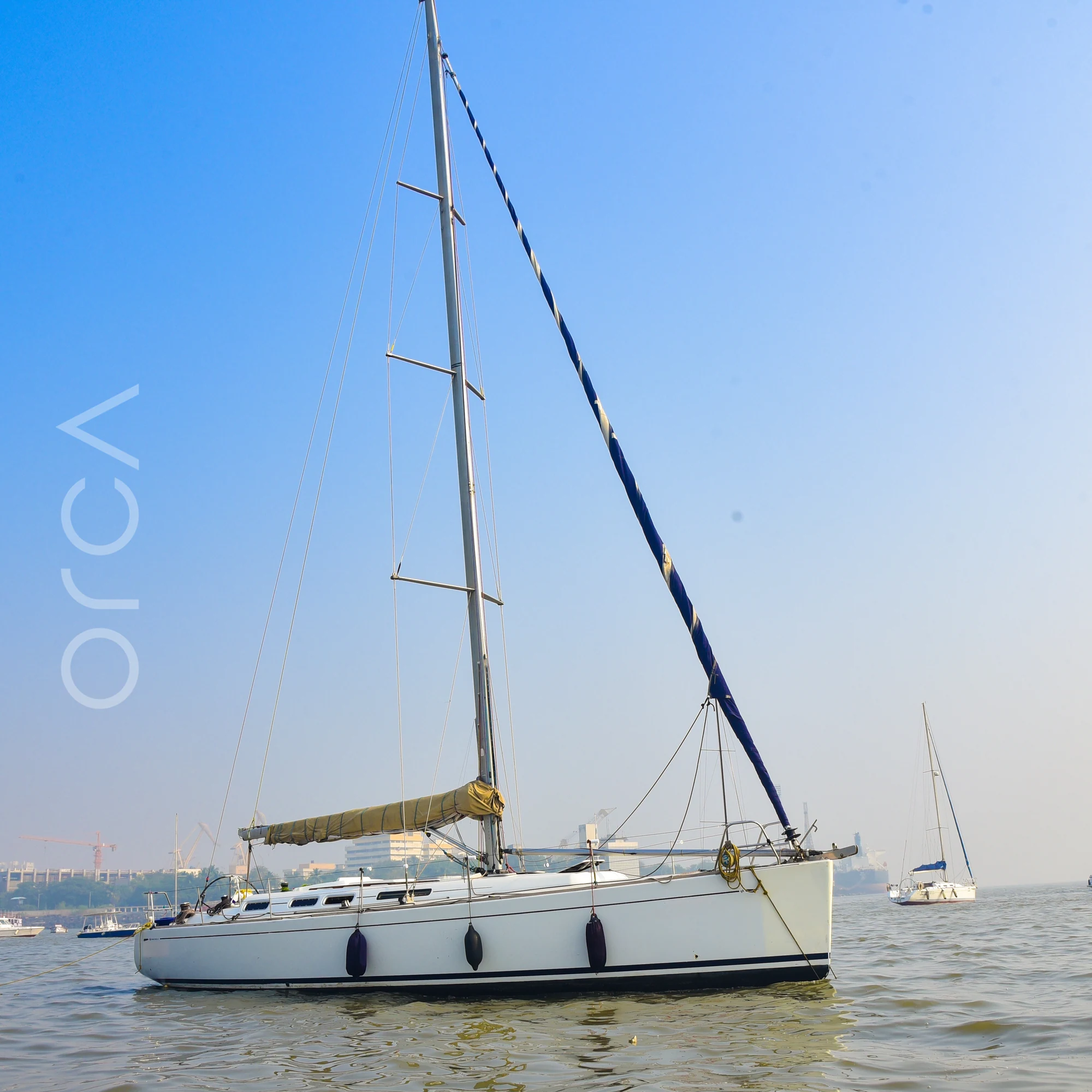 The full length of a Grand Soleil 45 sail yacht seen side-on in Mumbai harbour, available to rent from Orca Sail.