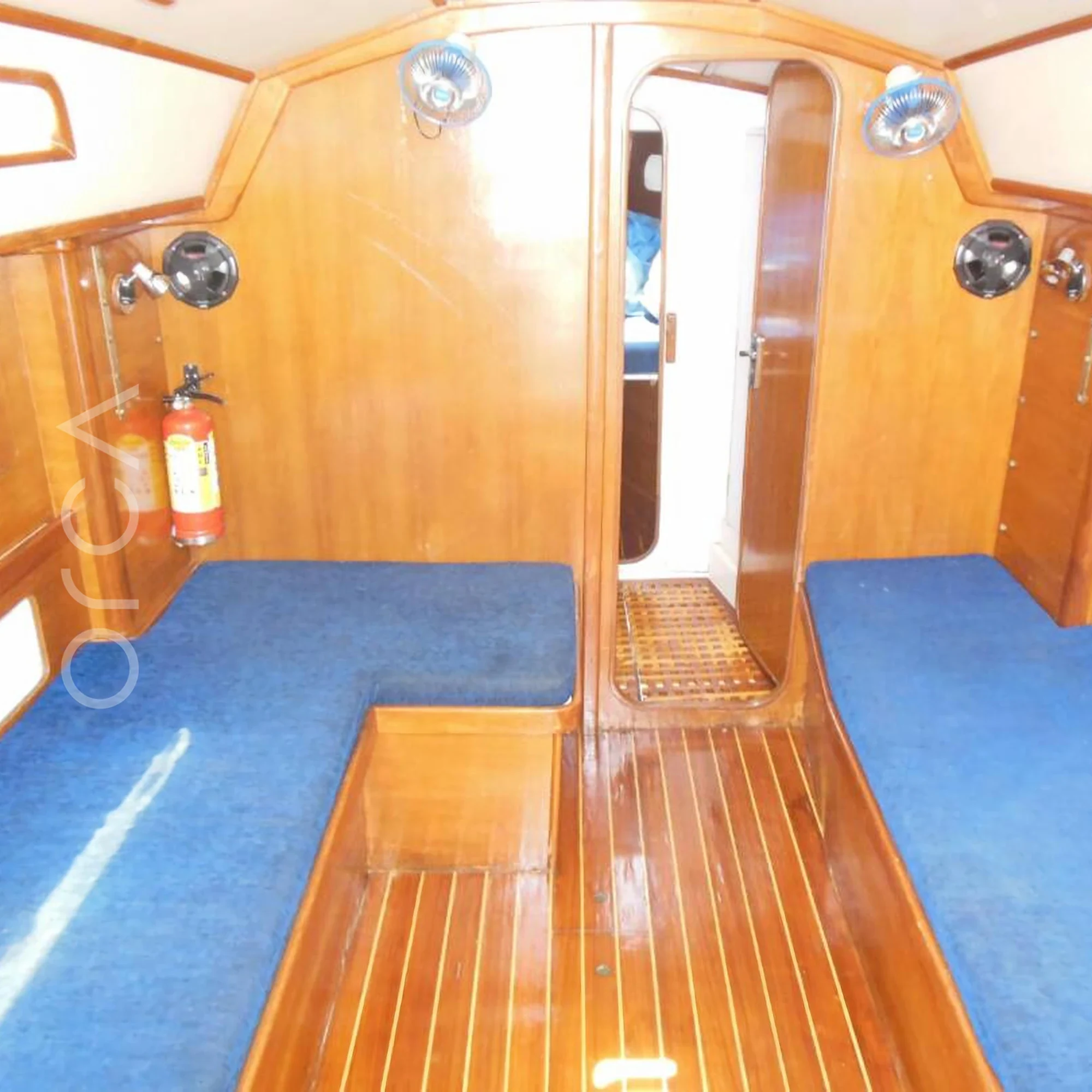 The main cabin aboard a Sigma 33 sail yacht in Mumbai, available to rent from Orca Sail.