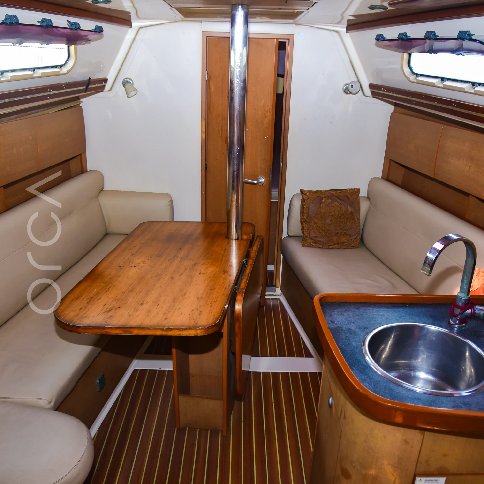 The main seating area aboard a Hanse 325 sail yacht in Mumbai, available to rent from Orca Sail.
