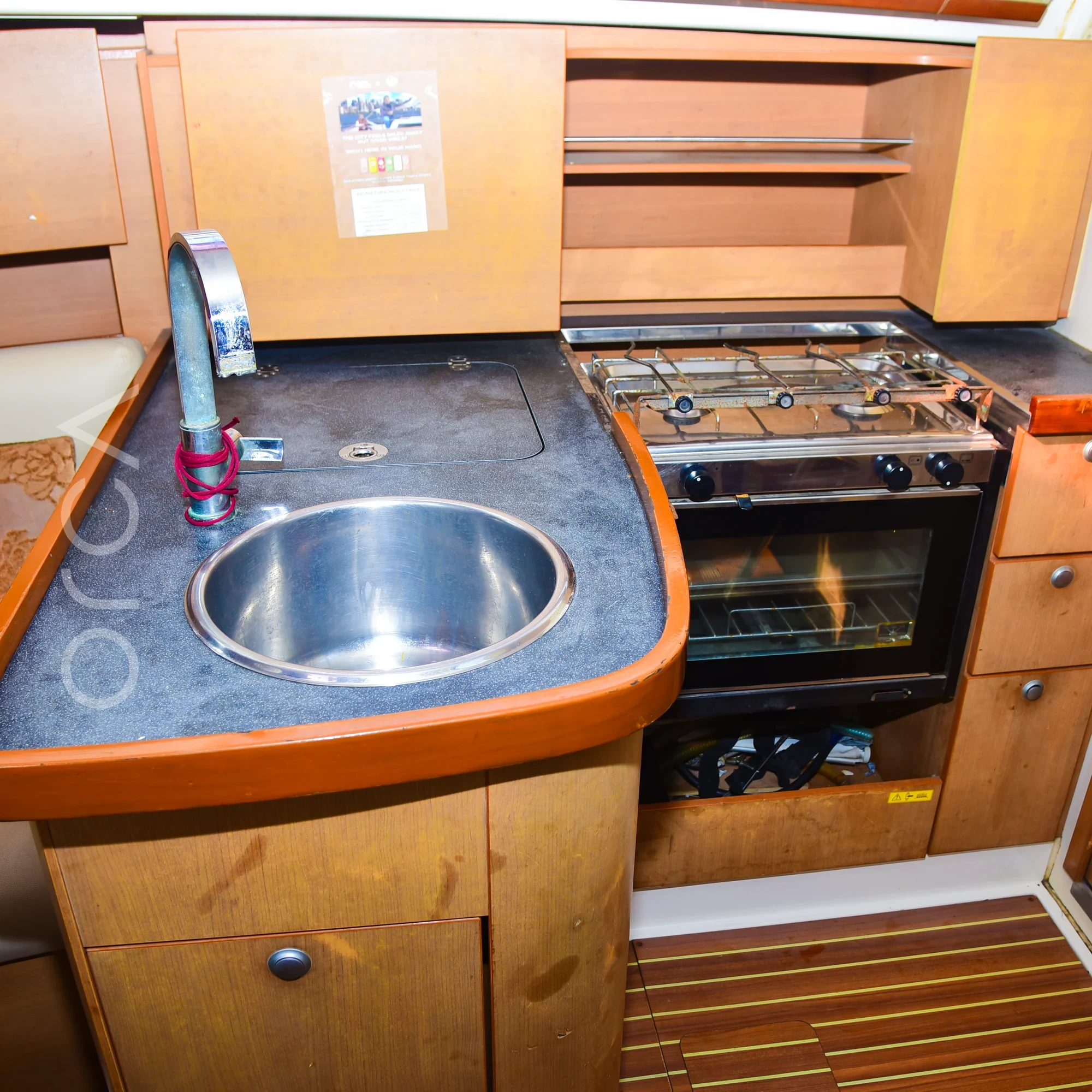 The galley aboard a Hanse 325 sail yacht in Mumbai, available to rent from Orca Sail.
