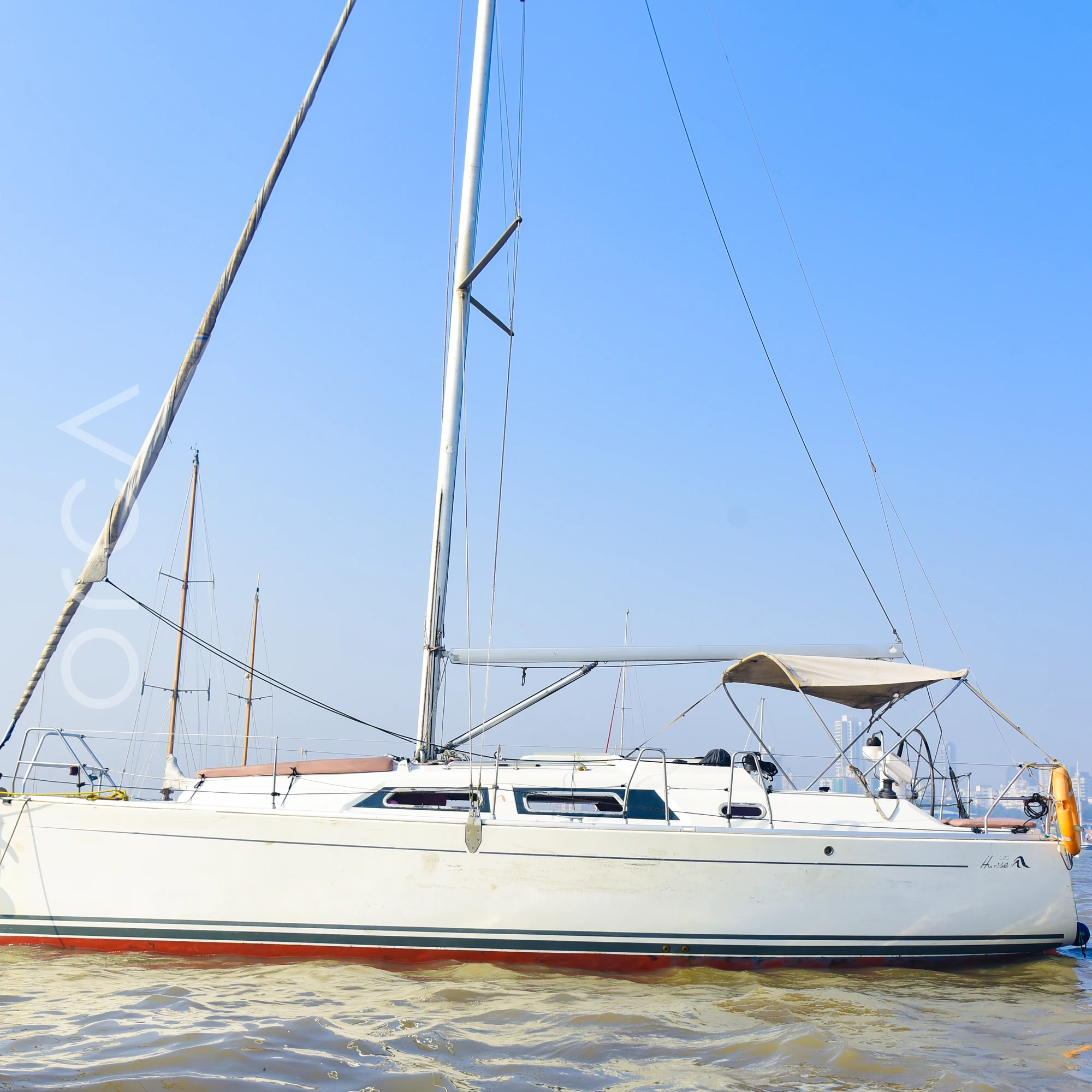 A Hanse 325 sail yacht seen side-on in Mumbai, available to rent from Orca Sail.