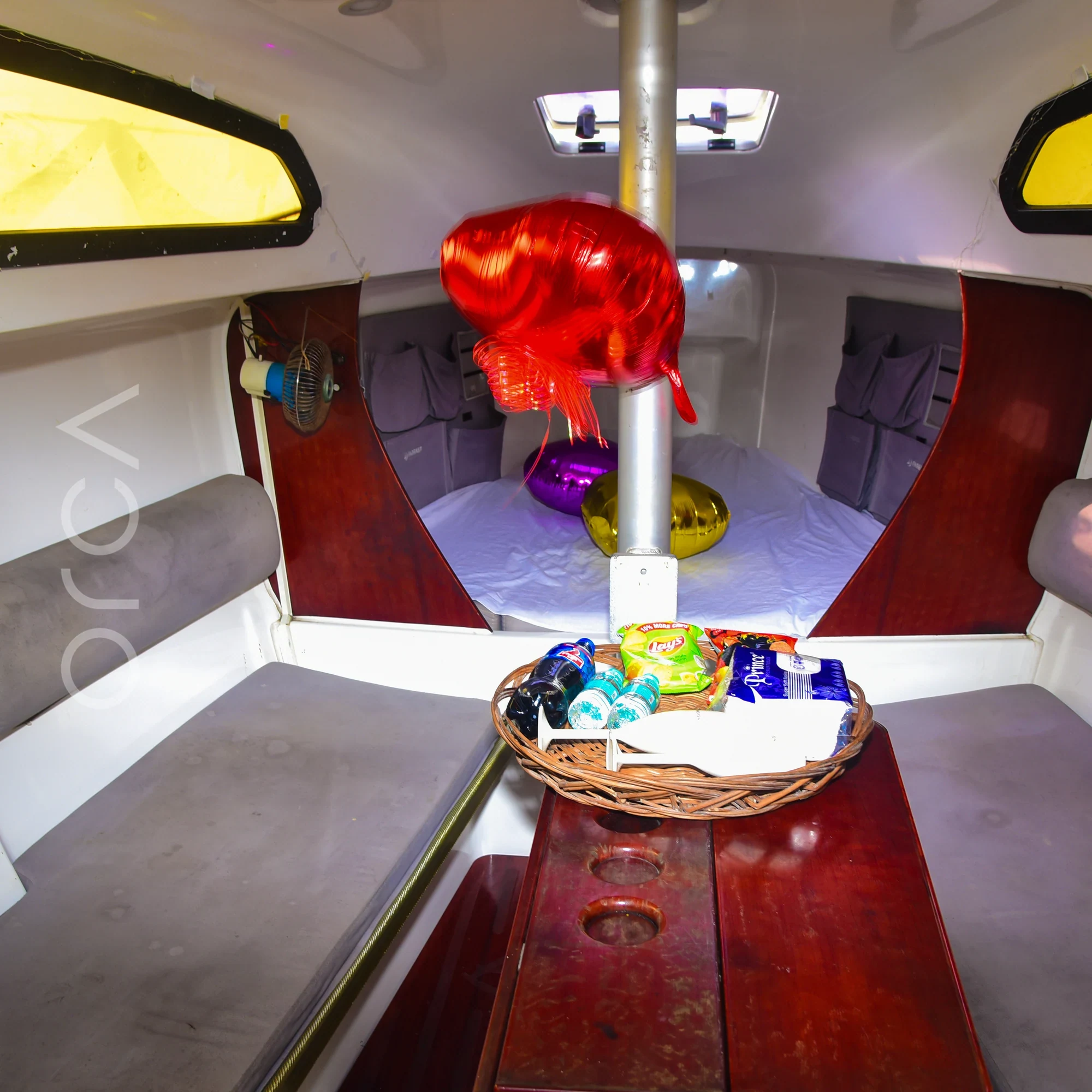 The main seating area aboard a Fareast 26 sail yacht in Mumbai, available to rent from Orca Sail.