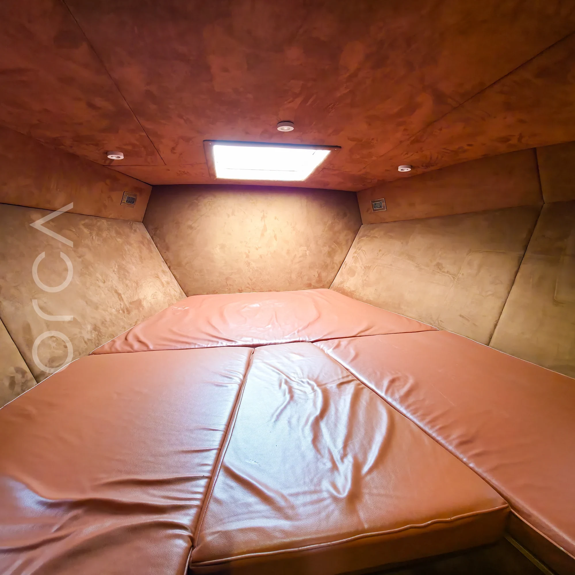 The main cabin aboard a Arc 52 cabin cruiser in Goa, available to rent from Orca Sail.