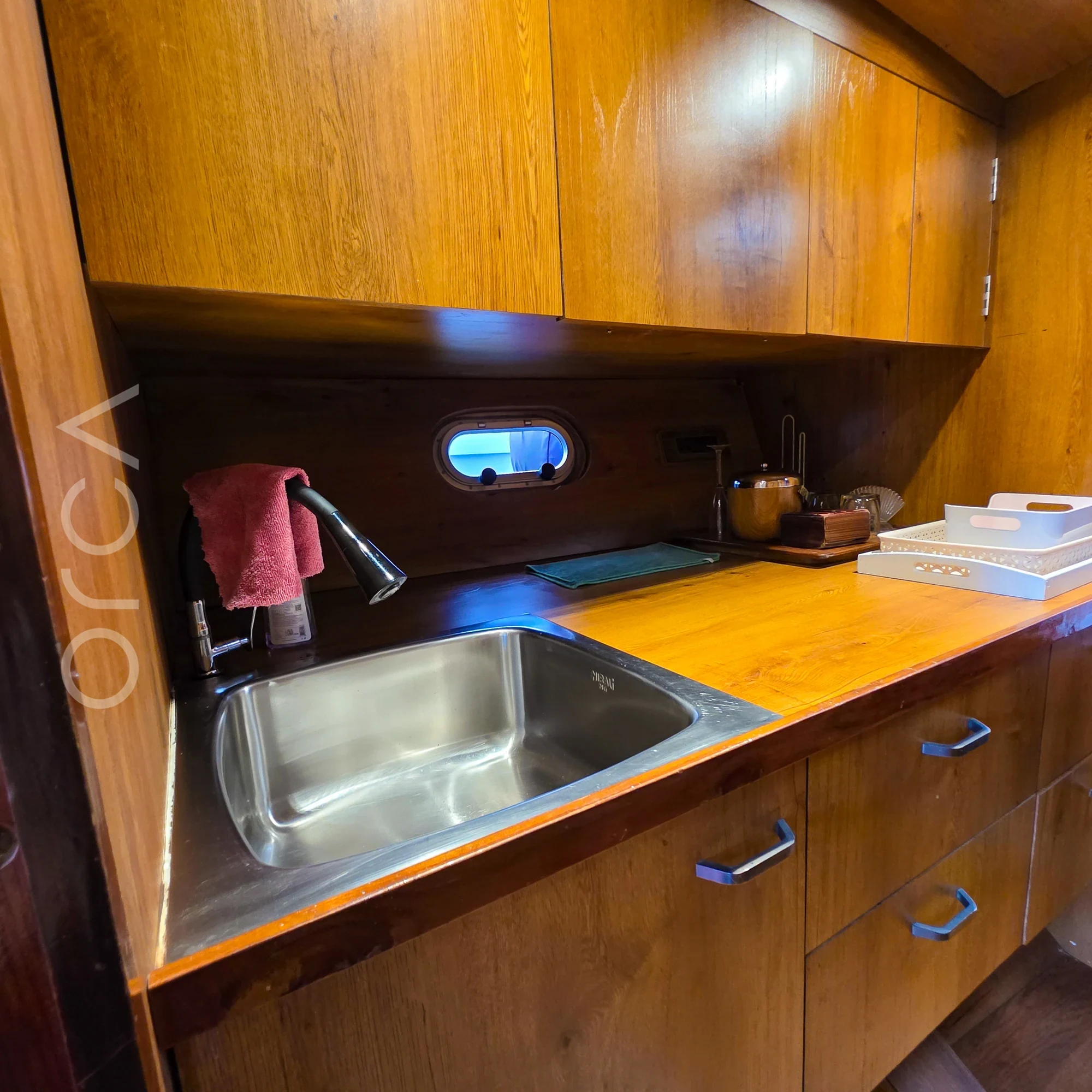 The galley aboard a Arc 52 cabin cruiser in Goa, available to rent from Orca Sail.