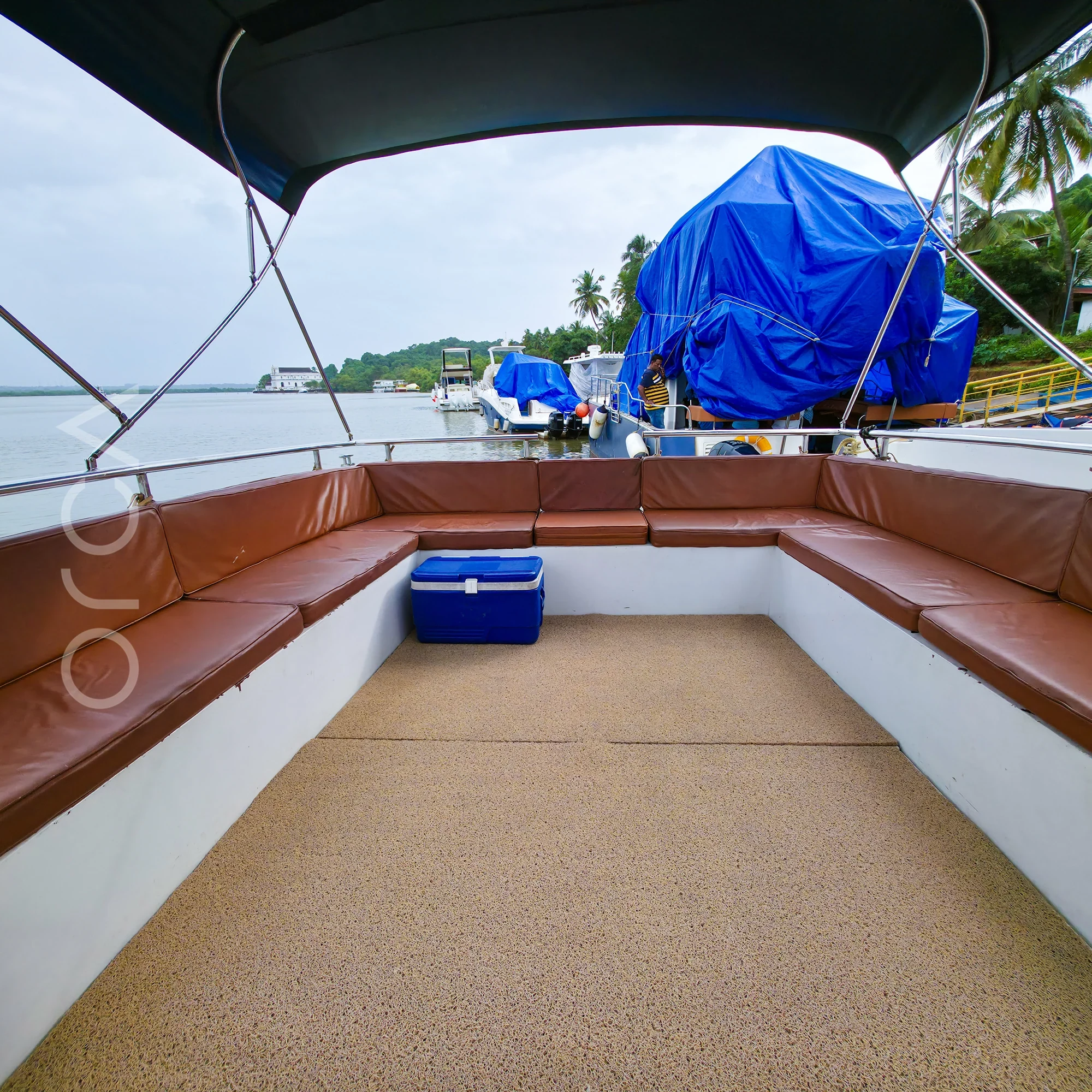The upper deck and helm area of a Arc 52 cabin cruiser in Goa, available to rent from Orca Sail.