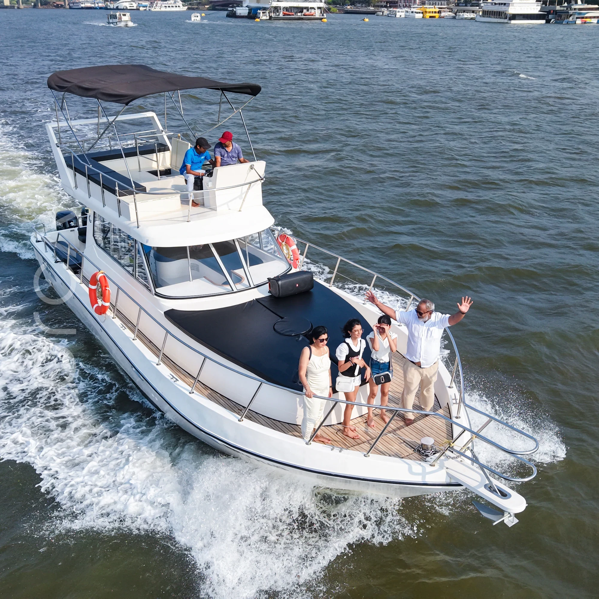 The cabin cruiser on the water in Goa, available to rent from Orca Sail.