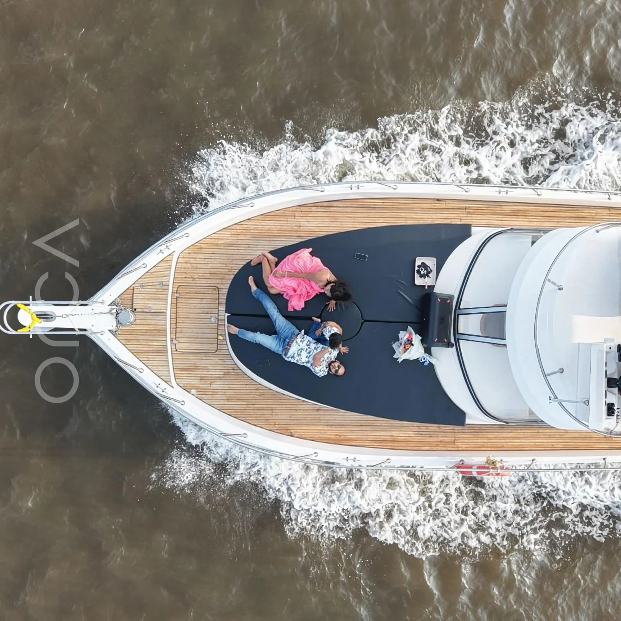 The bow deck of a cabin cruiser in Goa, available to rent from Orca Sail.
