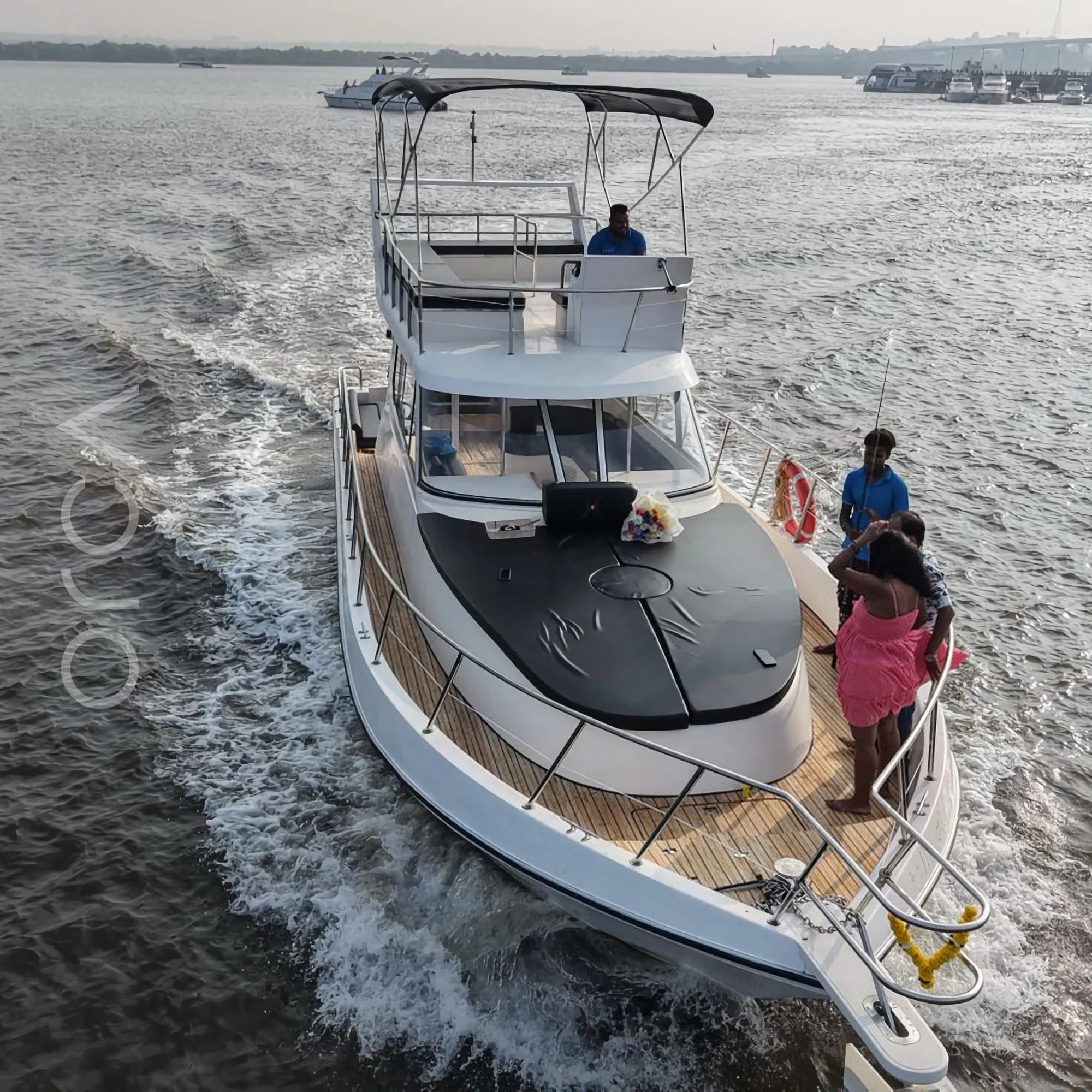 The aft deck of a cabin cruiser in Goa, available to rent from Orca Sail.