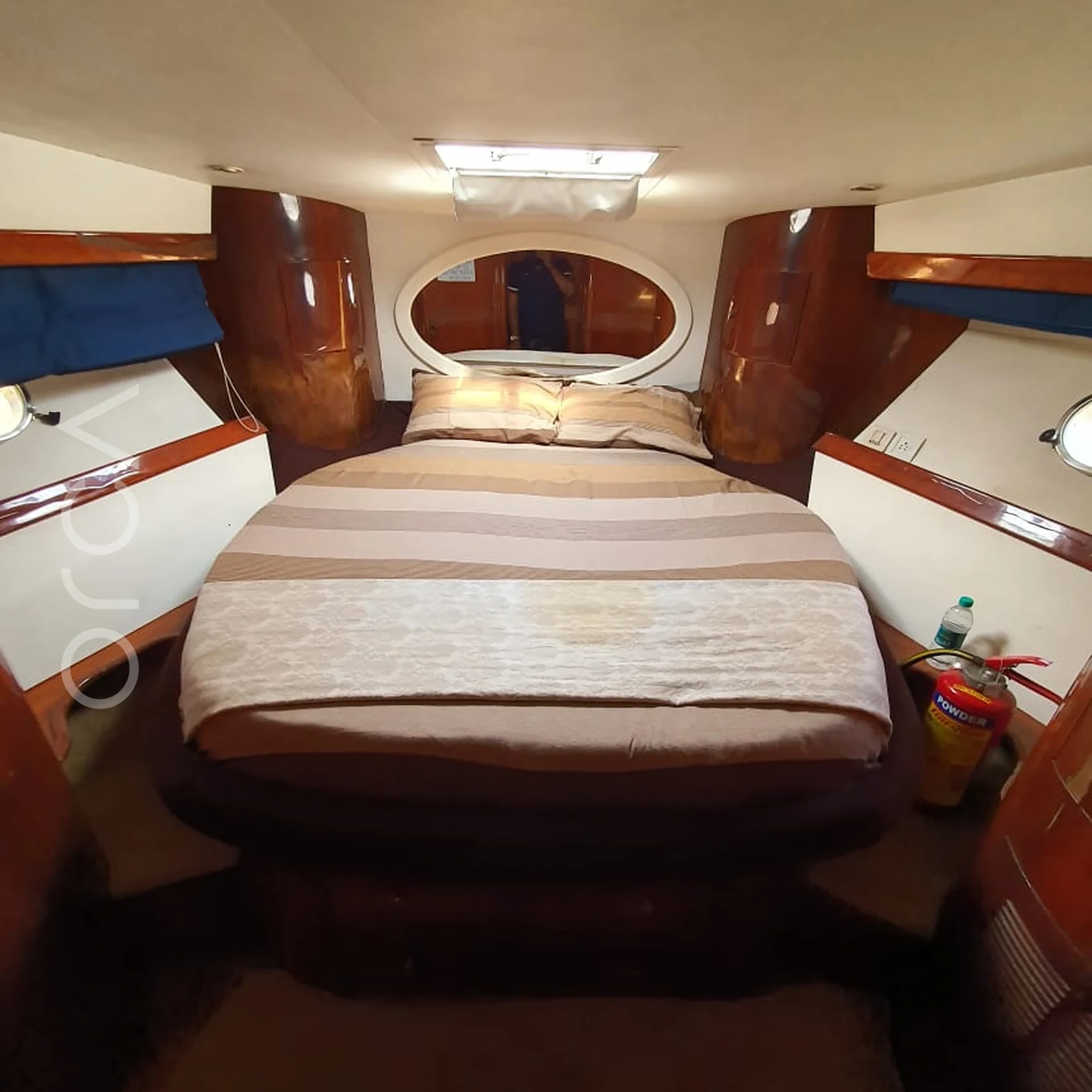The main cabin aboard a Majesty 47 motor yacht in Goa, available to rent from Orca Sail.