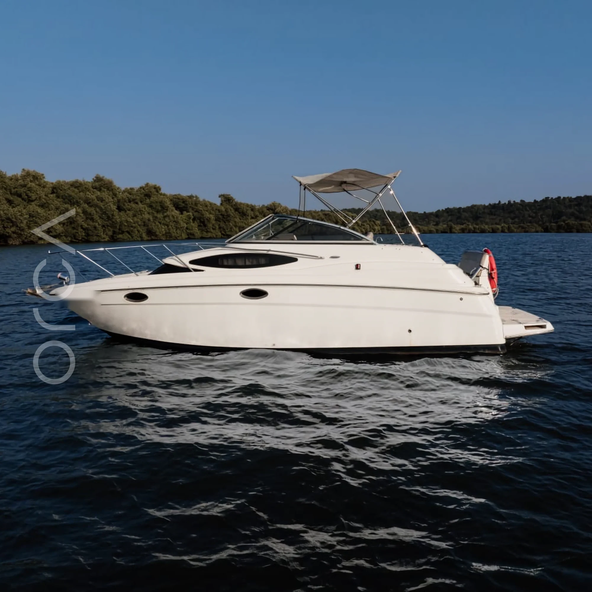 A Regal 2565 speedboat seen side-on in Goa, available to rent from Orca Sail.