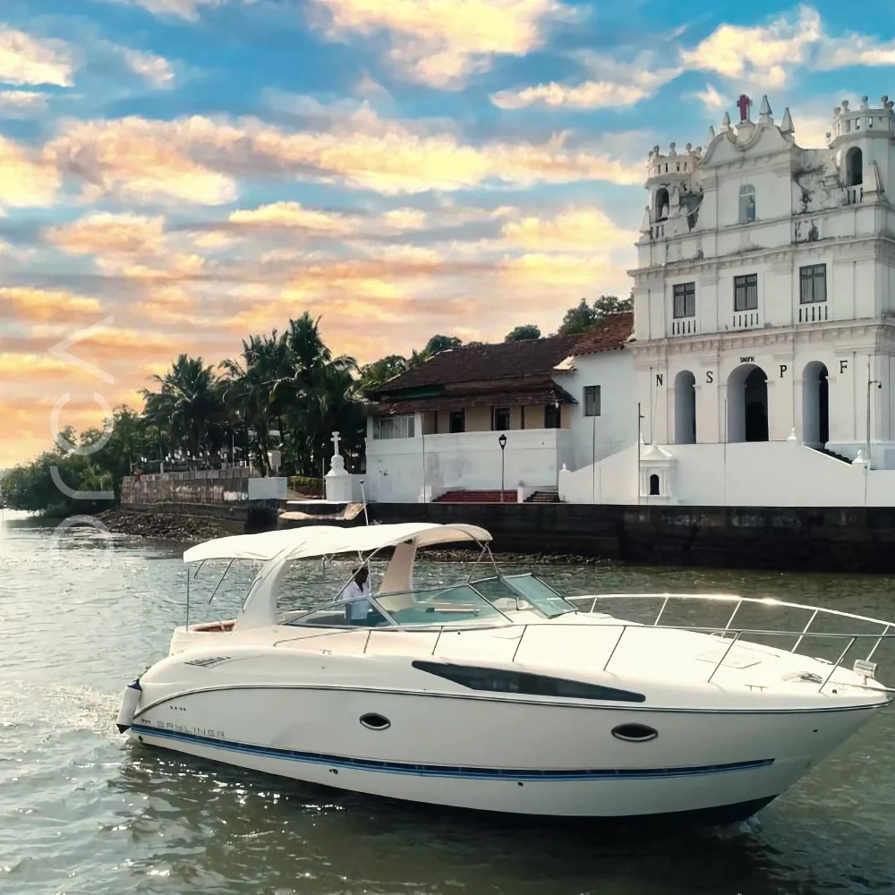 The Bayliner 340 motor yacht on the water in Goa, available to rent from Orca Sail.