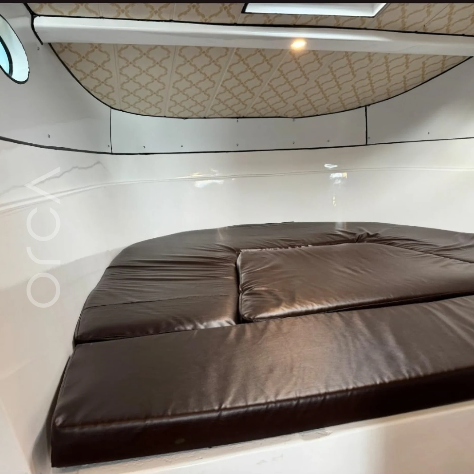 The main cabin aboard a Desire 32 cabin cruiser in Goa, available to rent from Orca Sail.