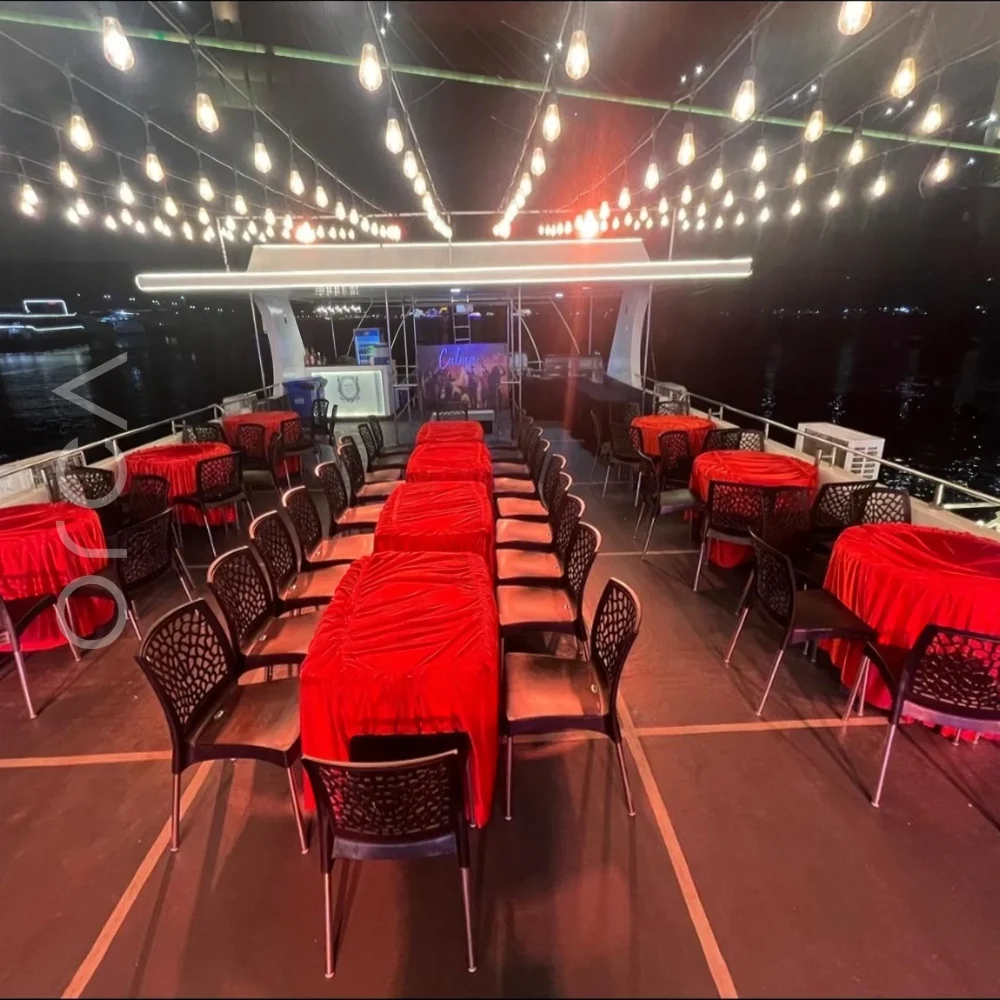 The main seating area aboard a cruise boat in Goa, available to rent from Orca Sail.