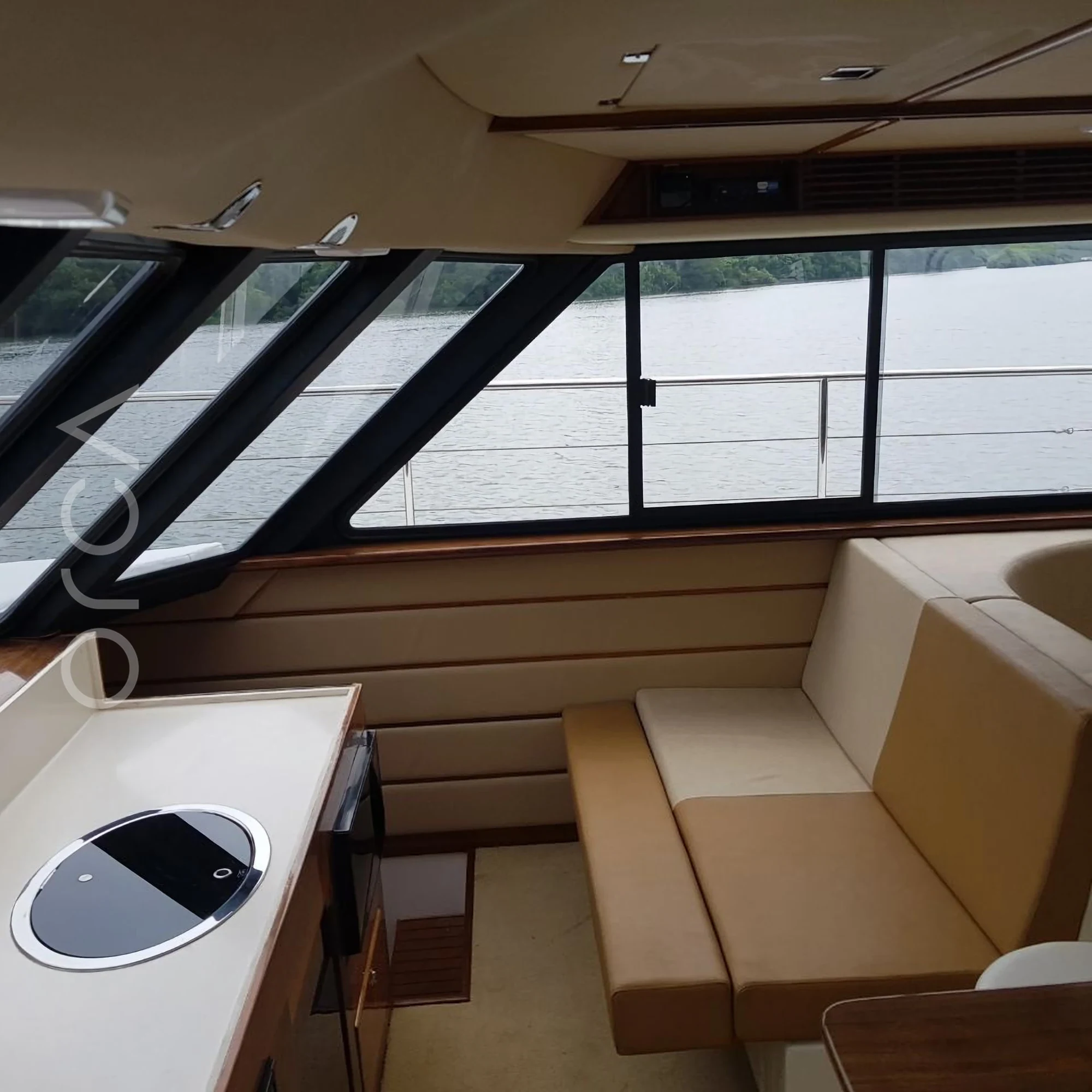 The upper deck and helm area of a Catamaran sail yacht catamaran in Goa, available to rent from Orca Sail.