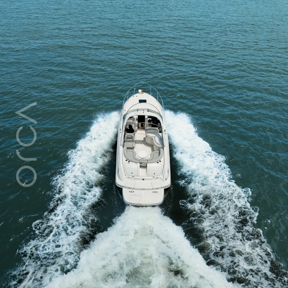 The Sea Ray 290 cabin cruiser on the water in Goa, available to rent from Orca Sail.