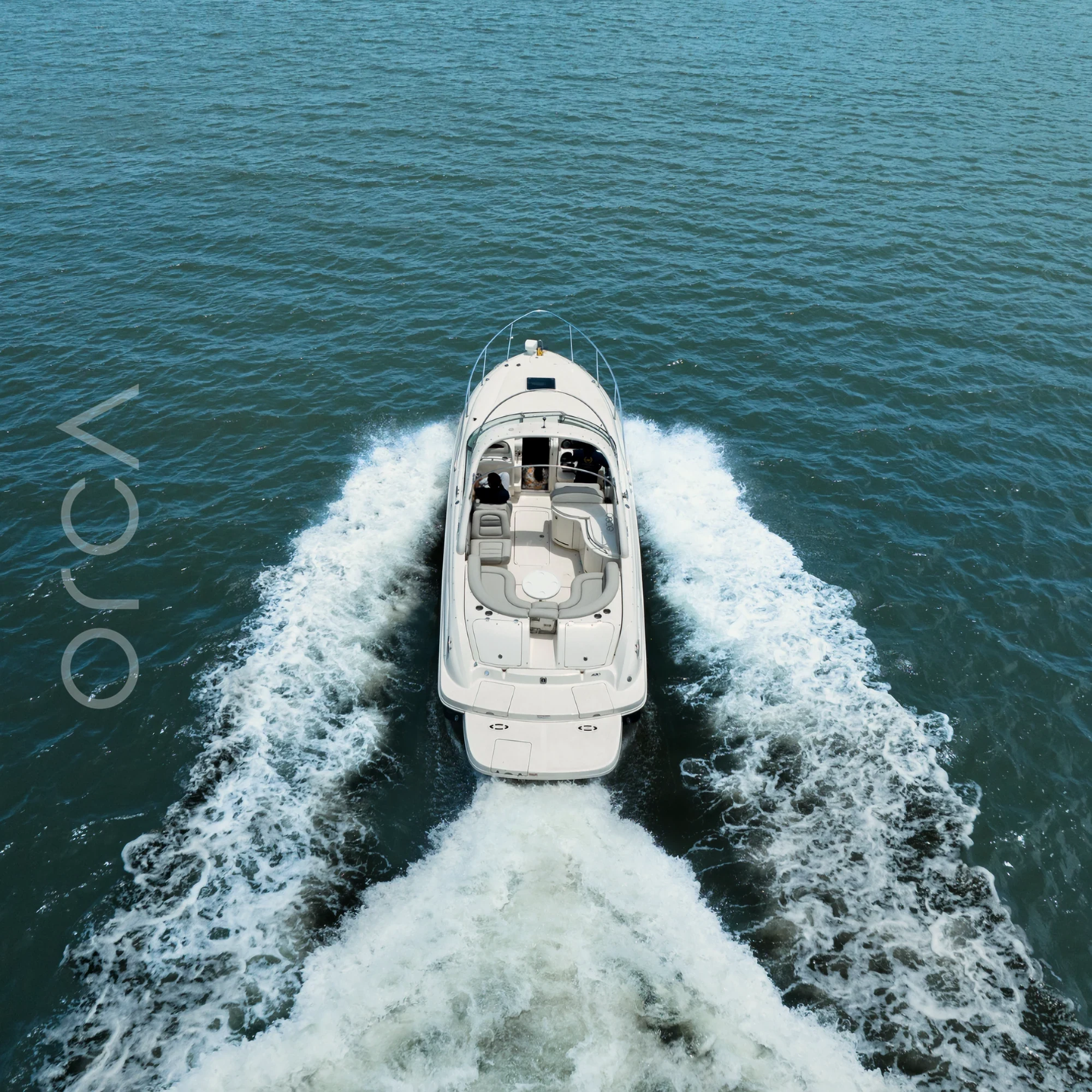 The Sea Ray 290 cabin cruiser on the water in Goa, available to rent from Orca Sail.