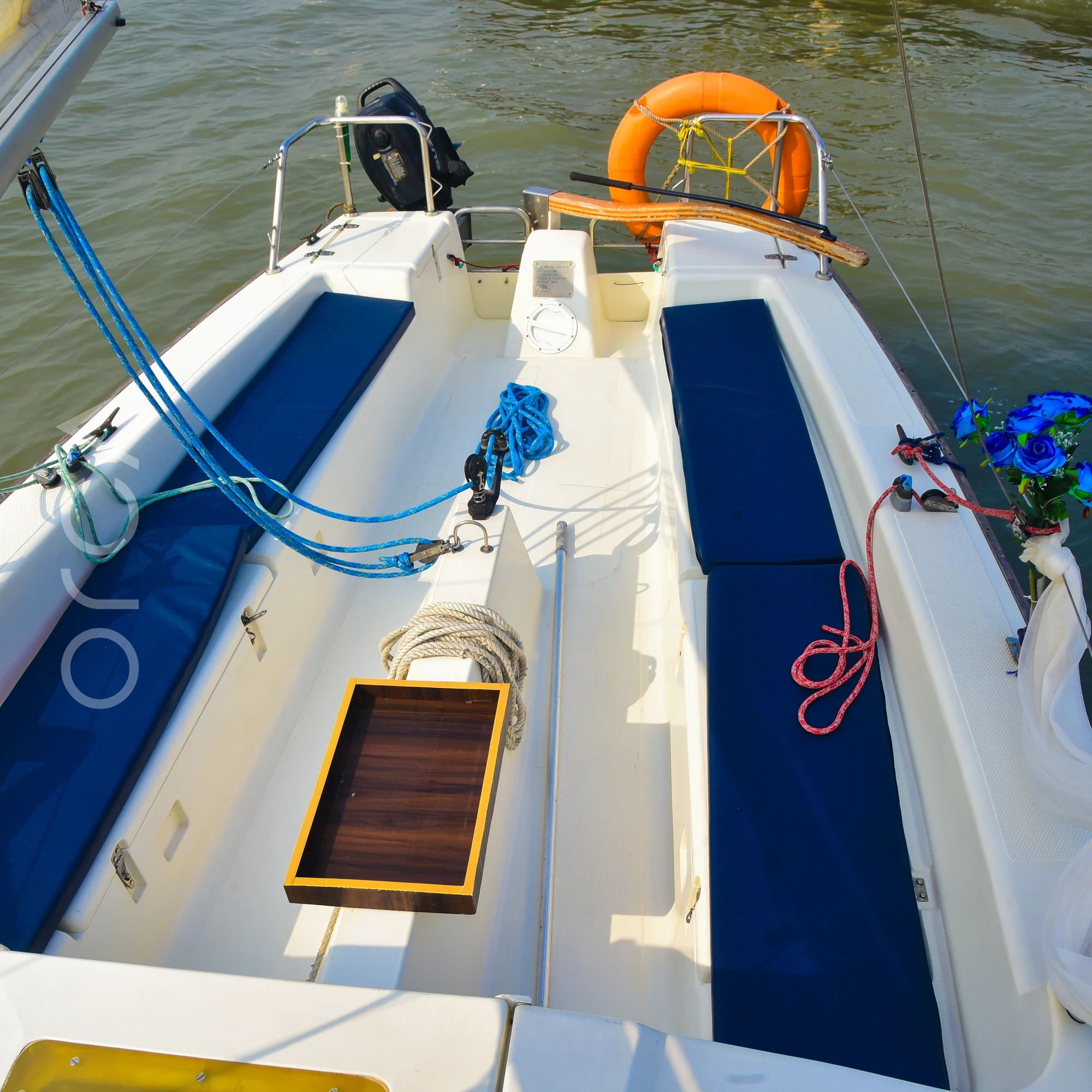 The aft deck of a XS63 sail boat in Mumbai, available to rent from Orca Sail.