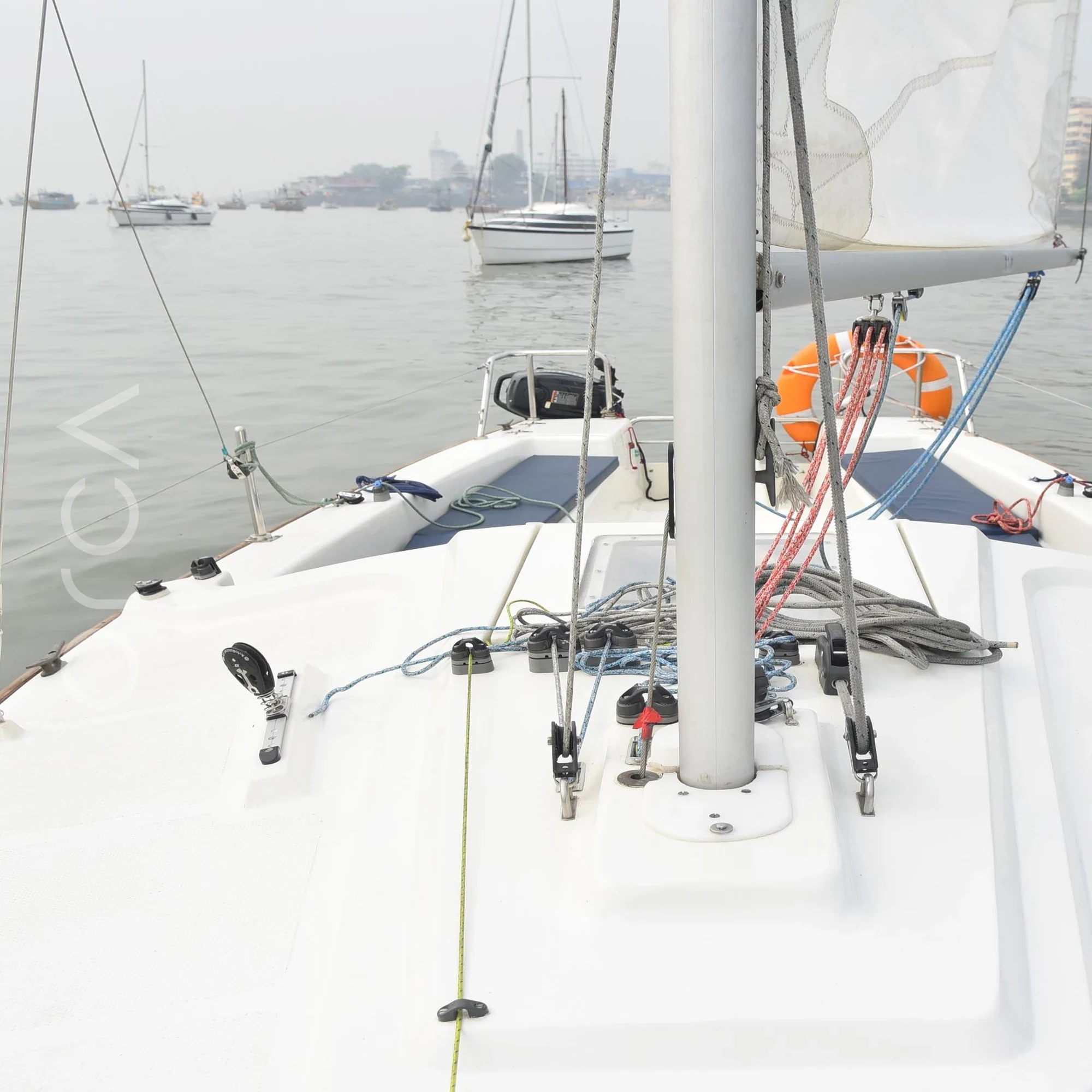 The upper deck and helm area of a XS63 sail boat in Mumbai, available to rent from Orca Sail.
