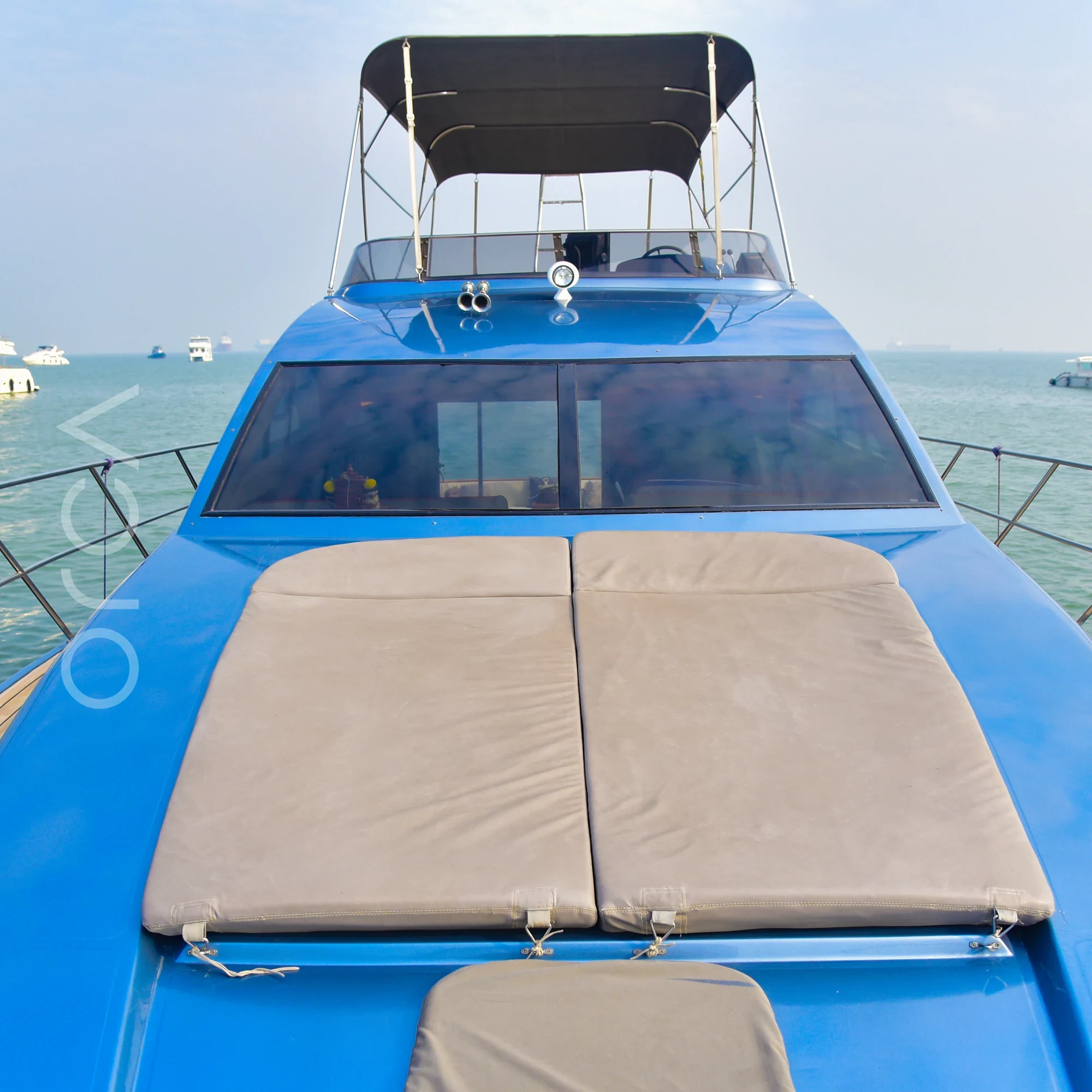 The bow deck of an Ambassador 47 motor yacht in Mumbai, available to rent from Orca Sail.