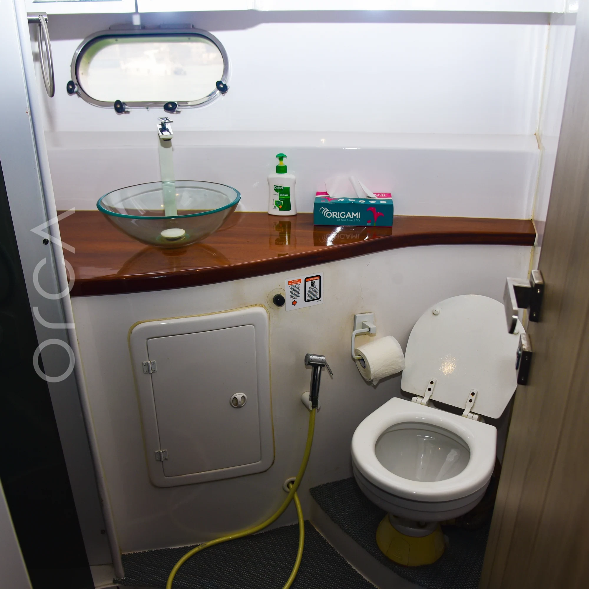 The bathroom aboard an Ambassador 47 motor yacht in Mumbai, available to rent from Orca Sail.