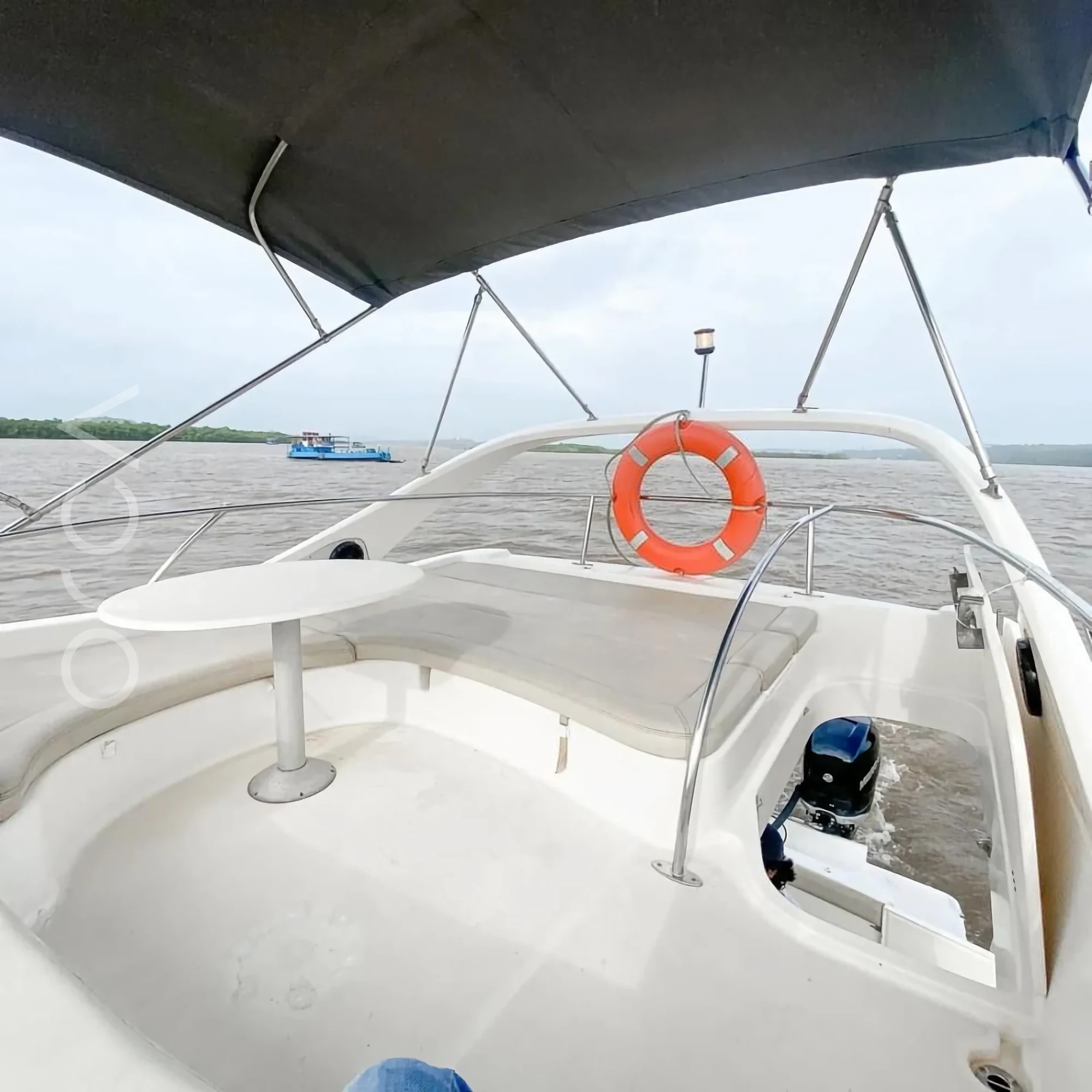 The upper deck and helm area of a Prestige 36 motor yacht in Goa, available to rent from Orca Sail.