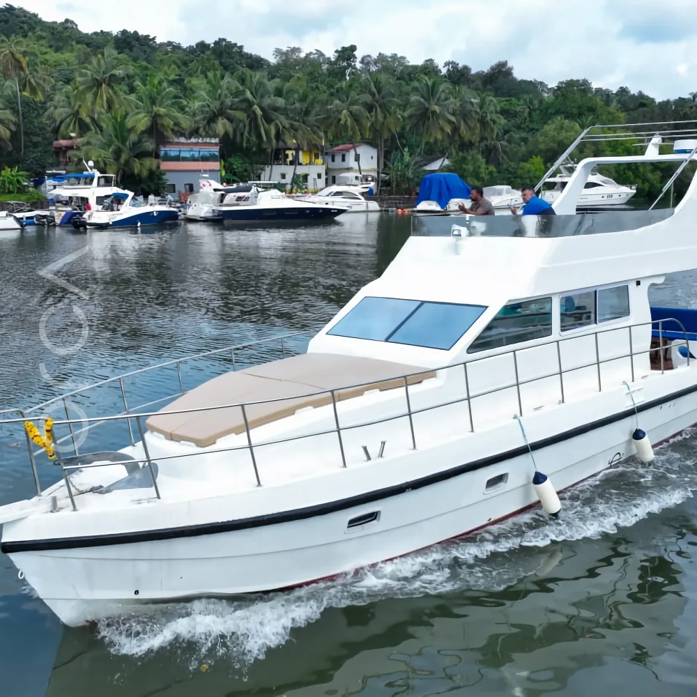 The Oasis motor yacht on the water in Goa, available to rent from Orca Sail.