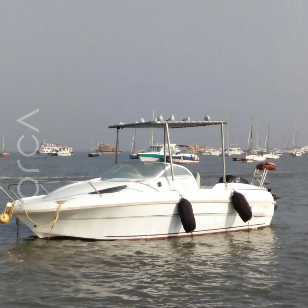 The speedboat on the water in Mumbai, representing the boats available to rent from Orca Sail.